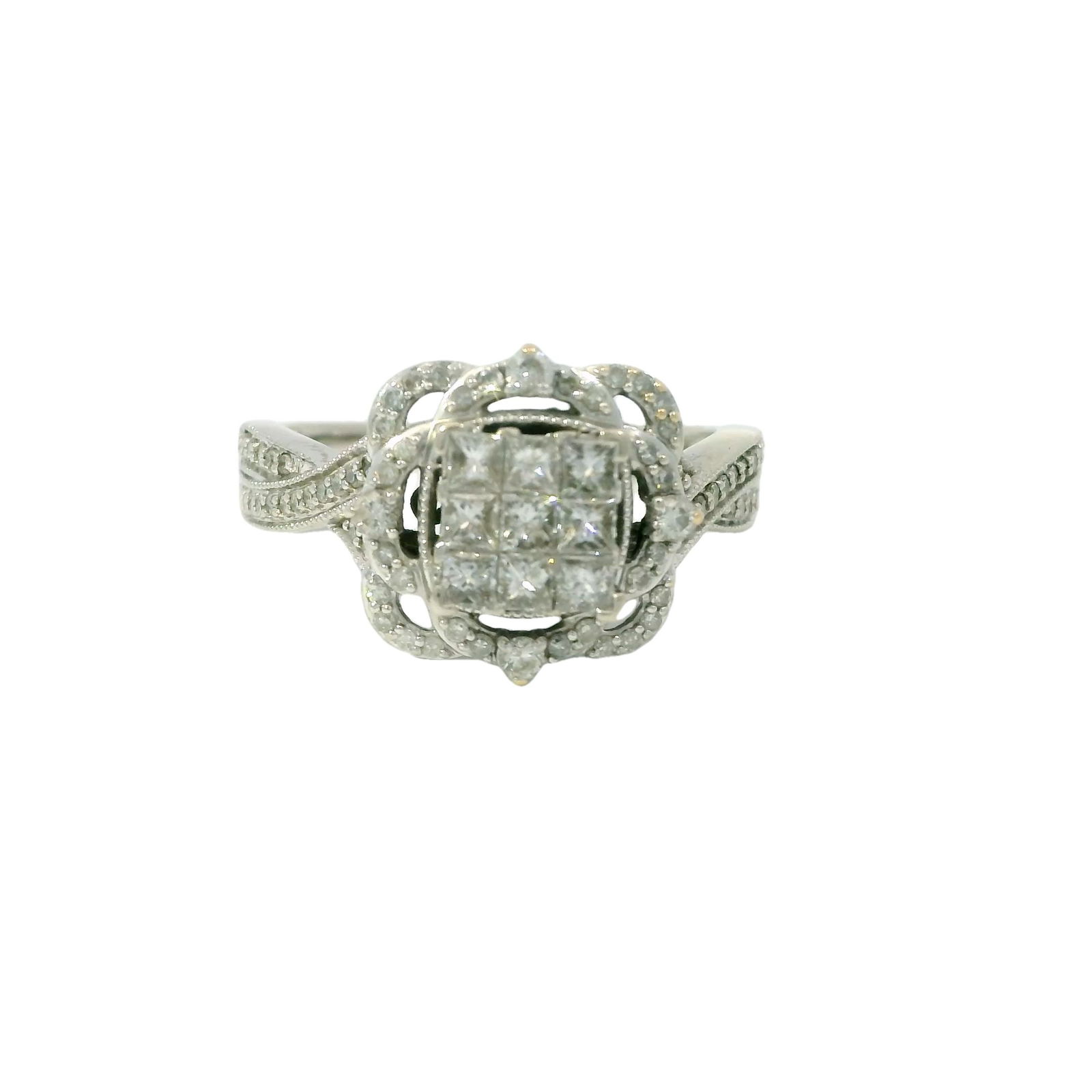 White Gold Diamond Ring: This exquisite diamond ring features a stunning central cluster of meticulously arranged diamonds, creating a brilliant and timeless look. The intricate detailing on the band adds an extra touch of