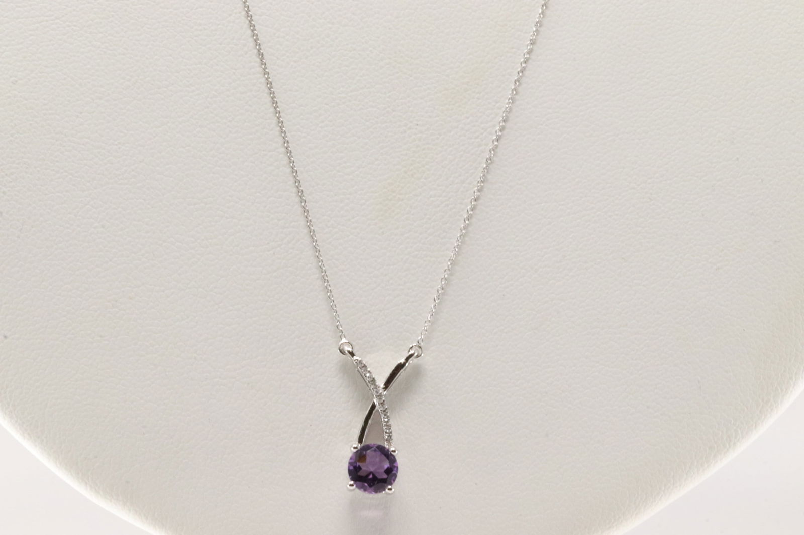 Amethyst & Diamond Pendant / Necklace 10Kt.: Ladies 10Kt White Gold Amethyst & Diamodn Pendant / Necklace. Necklace has Pendant with round Amethyst with Sparkling Diamonds. Necklace length: 18.00"