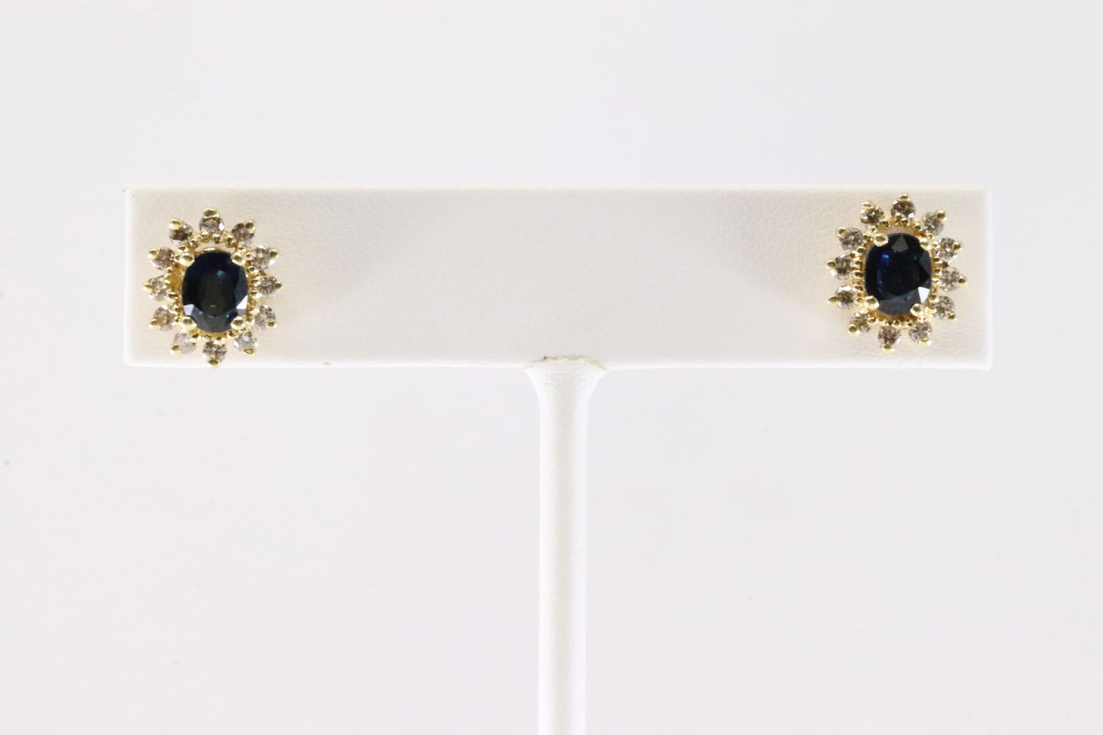Sapphire & Diamond Stud Earring 14Kt.: Ladies 14Kt Yellow Gold Sapphire & Diamond Stud Earring. This Charming Stud earring has 1 Sapphire to each Surrender by 12 Brilliants Diamonds. Total weight: 3.50 Grams.