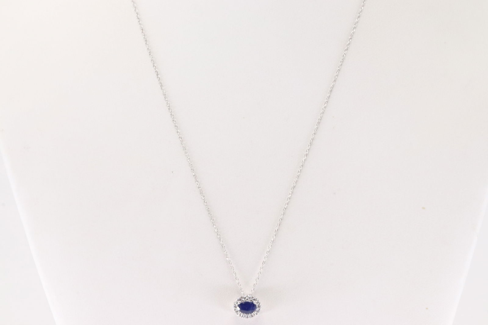 Sapphire & Diamond Pendant / Necklace 14Kt.: Ladies 14Kt White Gold Sapphire & Diamond Pendant / Necklace. This Charming Pendant has Oval Sapphire with 14 Round Diamonds and A Necklace. Sapphire weight: 0.55ct. Diamonds weight: 0.15ctw. Necklace