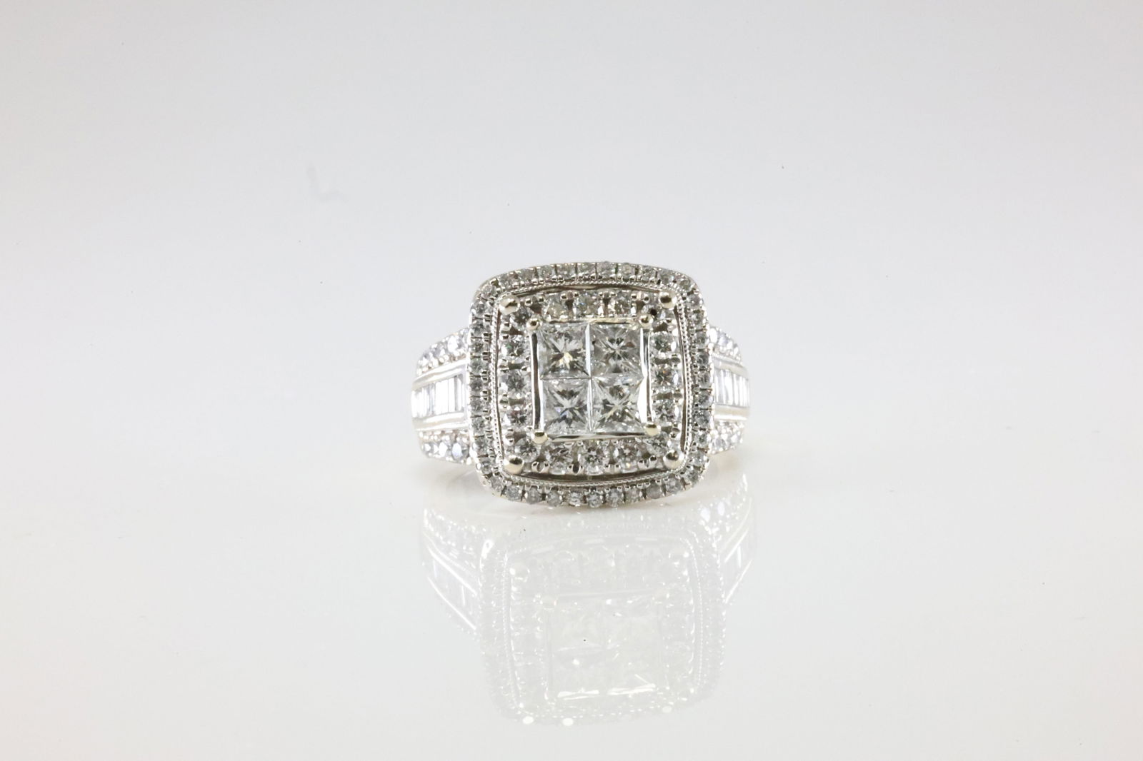 Diamond Ring 14Kt.: Ladies 14kt White Gold Diamond Ring. This Charming Ring has 80 Round / 20 Baguette Diamonds. Diamond Weight Approx: 2.50ctw. Ring Size: 8.50. Total Weight: 11.46 Grams.