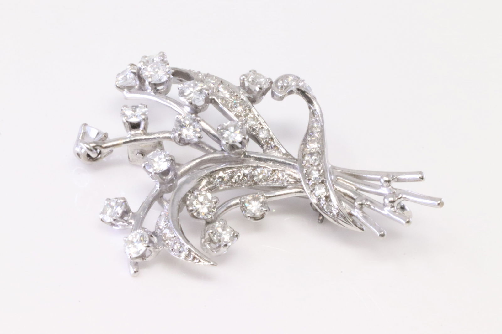 Diamond Spray Pin / Brooch 18Kt.: 18Kt White Gold Diamond Spray Pin / Brooch. Pin Brooch has 38 Diamonds. Diamonds approx weight: 2.75 ctwTotal weight: 8.10 Grams.