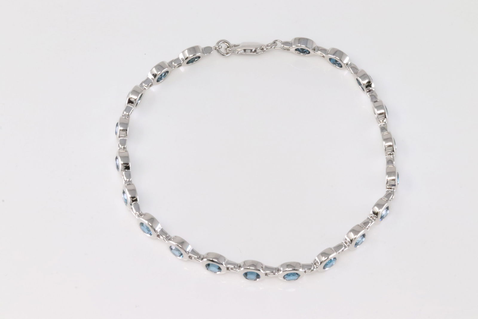 Elegant London Blue Topaz Bracelet 14Kt.: 14Kt White Gold London Blue Topaz Bracelet. This Elegant Bracelet has 20 round London Blue Topaz. Bracelet Length: 8.00" Total weight: 14.30 Grams.