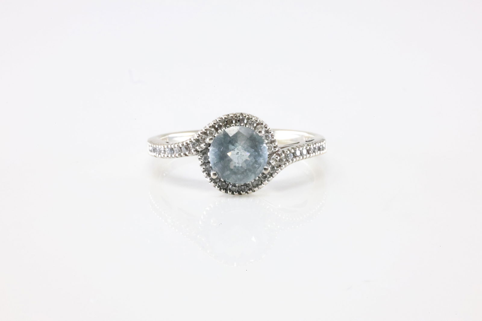 Aquamarine & Diamond Ring 10Kt.: Ladies 10Kt White Gold Aquamarine & Diamond Ring. This Ring has Beautiful Aquamarine Gemstone With 34 Round Sparkling Diamonds. Ring Size: 7.00. Total Weight: 1.90 Grams.
