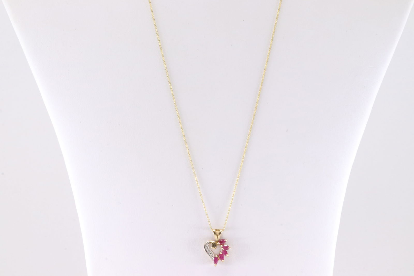 Ruby & Diamond Herat Pendant / Necklace 10Kt .: Ladies 10Kt Yellow Gold Ruby & Diamond Heart Pendant / Necklace. This Charming Heart pendant has Pink Rubies with round Diamonds and A 14K Necklace. Necklace length: 22.00" Total weight: 2.4 Grams.