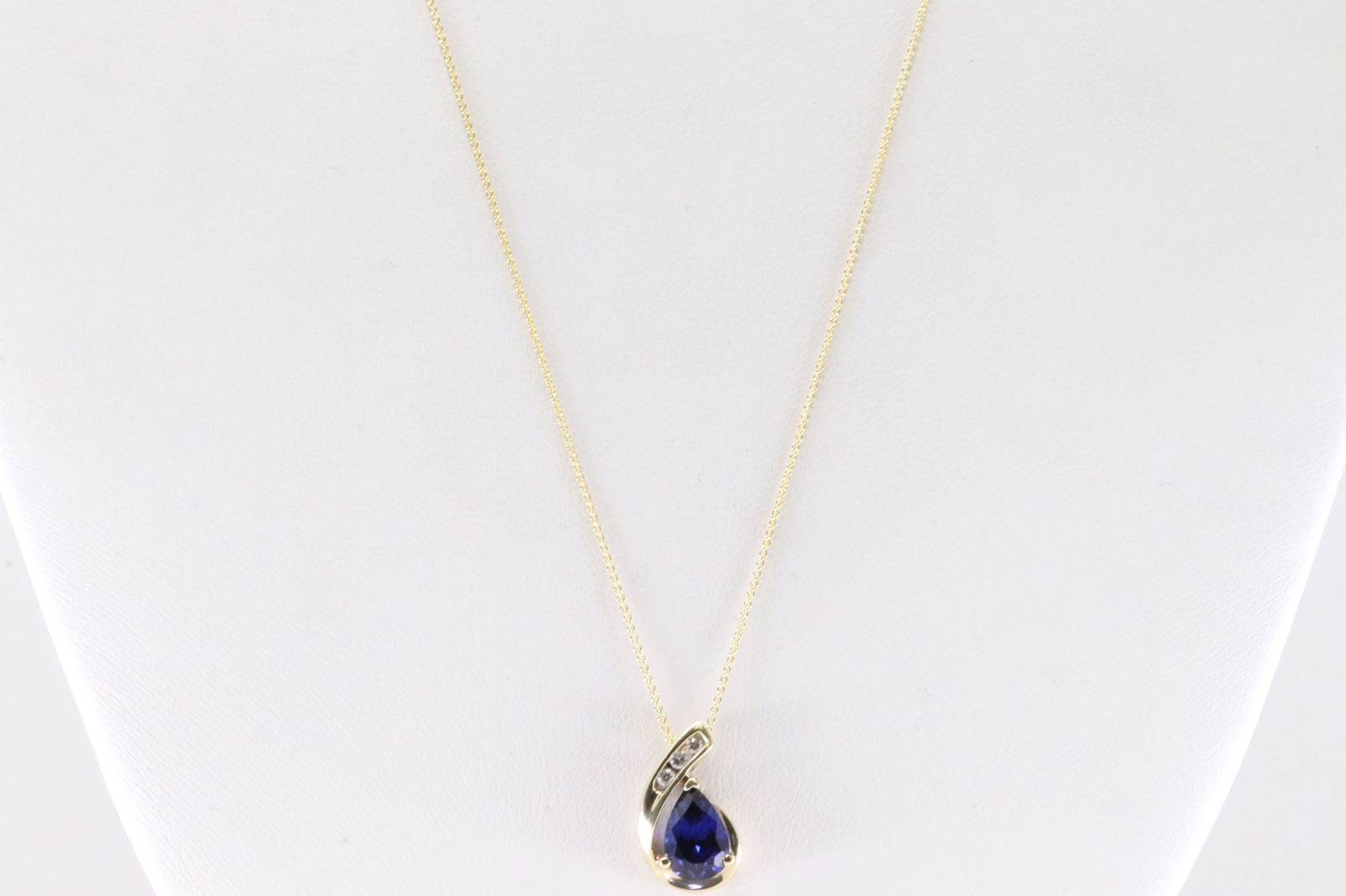 Sapphire & Diamond Pendant / Necklace 10Kt.: 10Kt Yellow Gold Sapphire & Diamond Pendant / Necklace. This Elegant Pendant has Pearl Blue Sapphire with 3 Sparkling Diamonds and A 14K Necklace. Necklace length: 22.00" Total weight: 2.70 Grams.