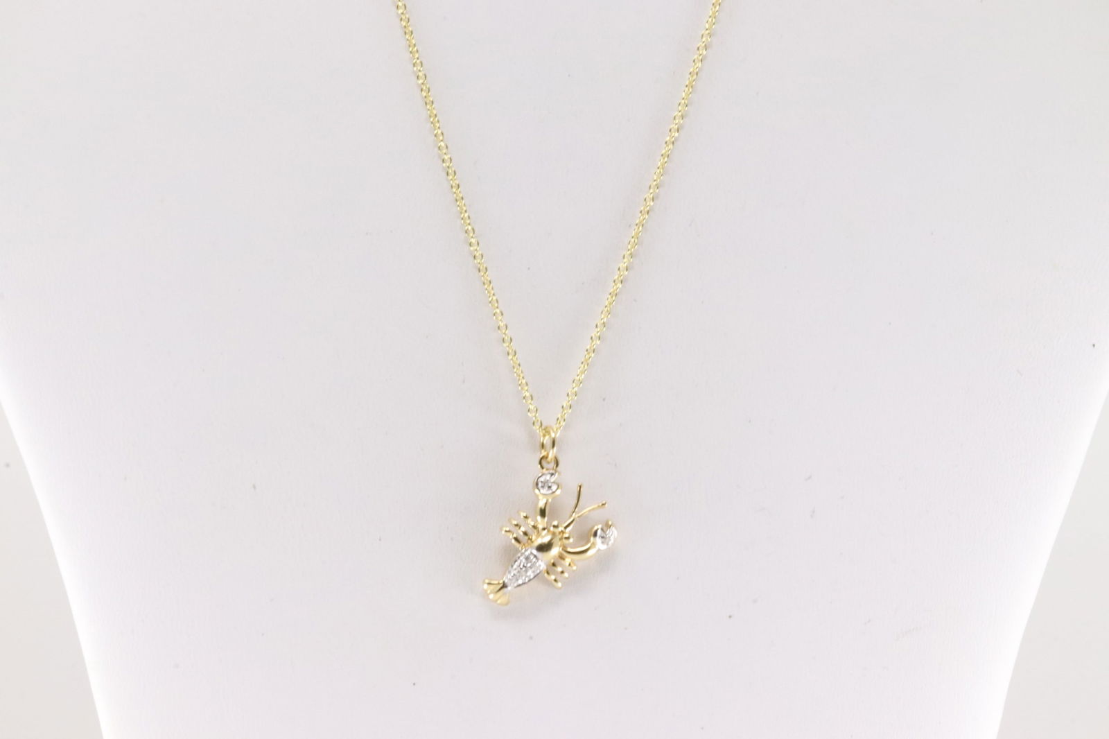 Lobster Diamond Pendant / Necklace14Kt.: 14Kt Yellow Gold Lobster Diamond Pendant / Necklace. This lobster pendant has 6 round diamonds with a 14k necklace. Necklace length: 18.00" Total weight: 3.80 Grams.