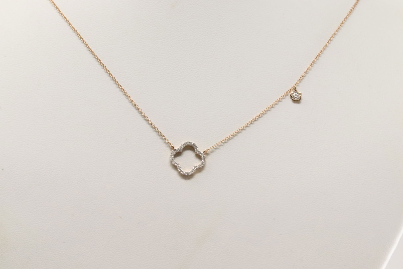 Diamond Necklace 14Kt.: 14Kt Rose Gold Diamond Necklace. This Necklace has 2 Flower Charms with 34 Saprkling Diamonds. Diamonds weight: 0.17ctw. Necklace length: 18.00"