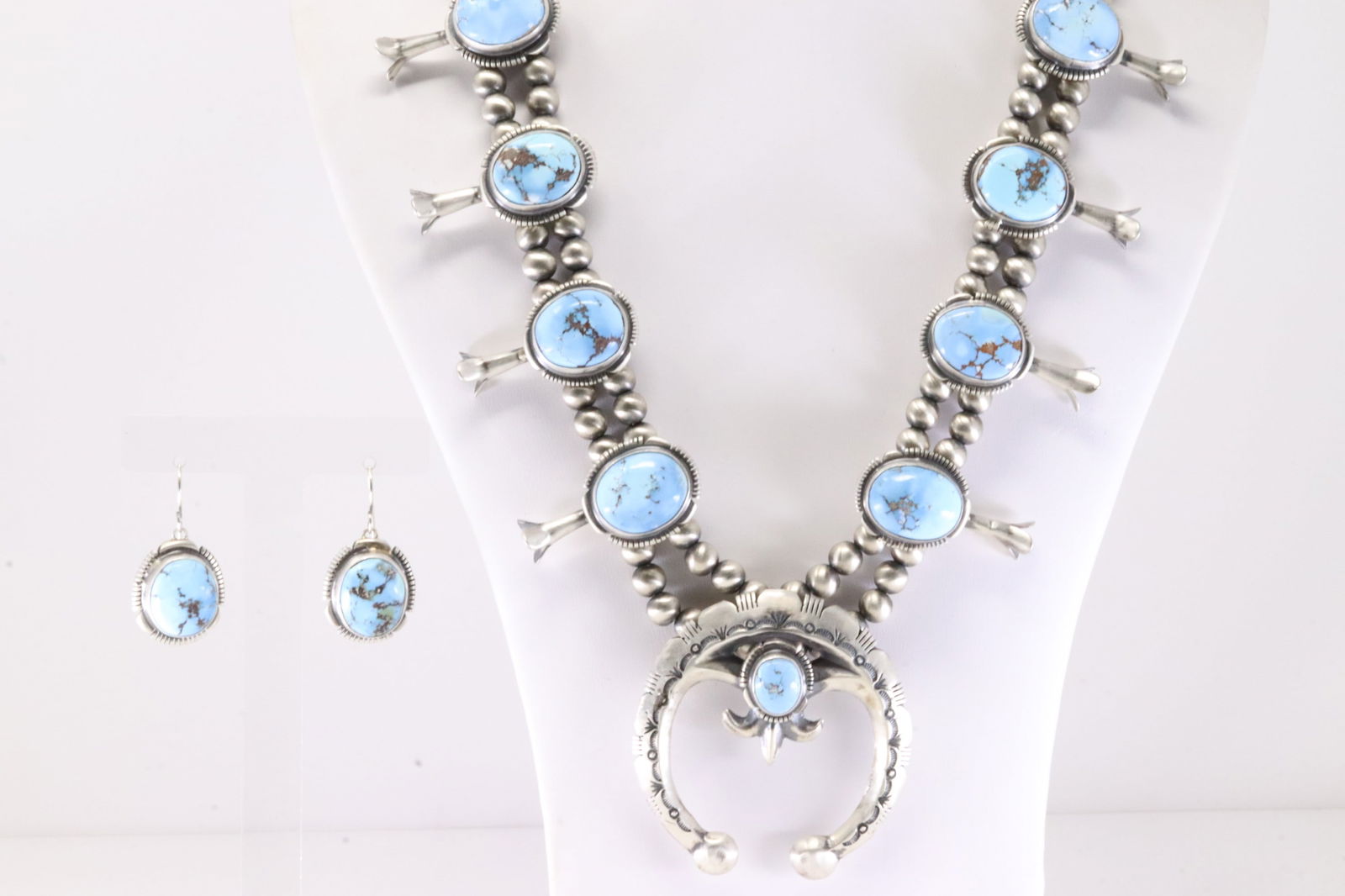 Native America Navajo Sterling Silver Golden Hill Turquoise Squash Blossom Necklace & Earring's Set: This is a Native America Navajo Sterling Silver Golden Hill Turquoise Squash Blossom Necklace & Earring's Set By R.T. Necklace length: 30.00" Total weight: 160.00 Grams.