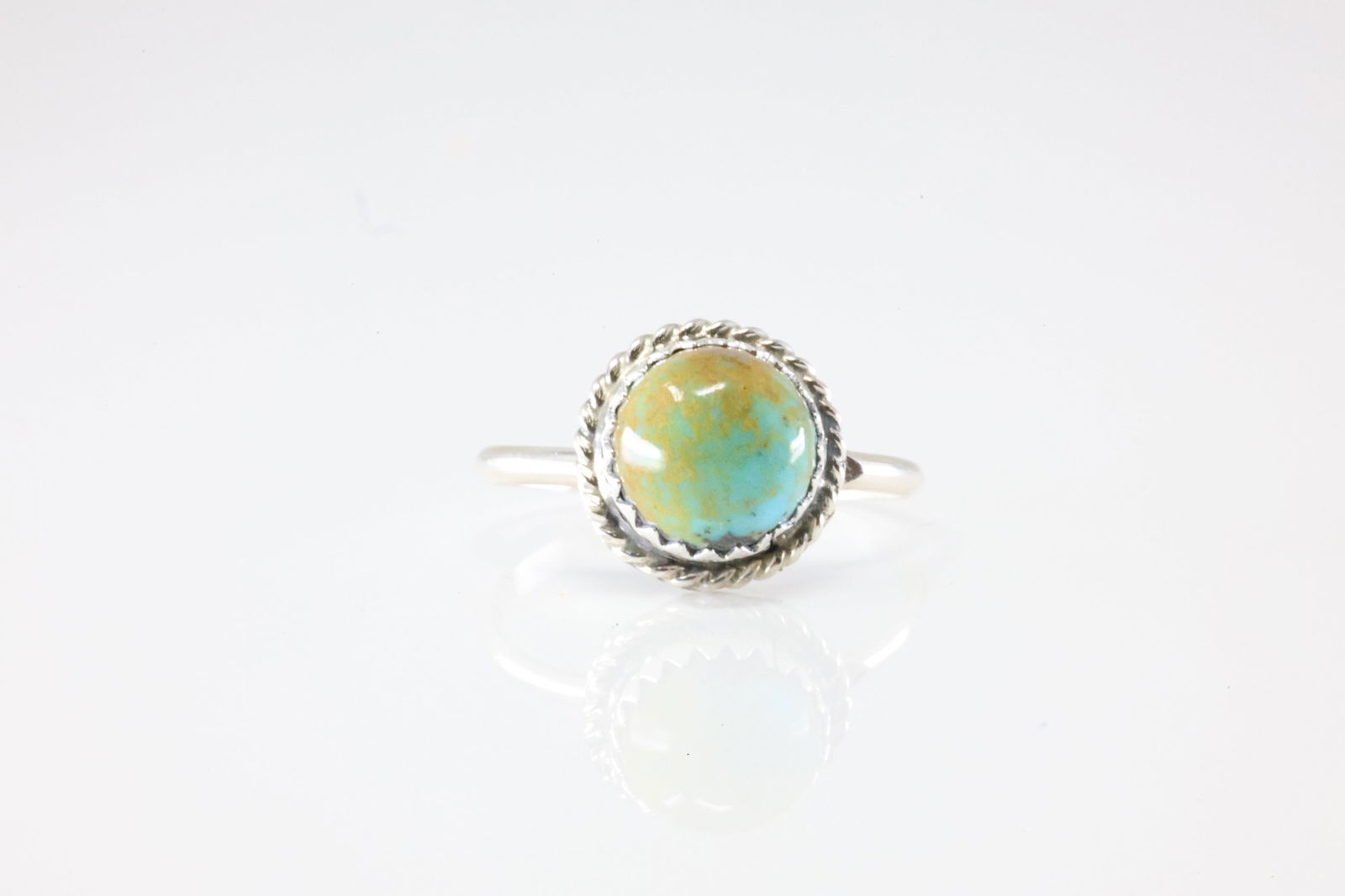 Native America Navajo Sterling Silver Turquoise Ring By Esther White.: This is a Native America Navajo Sterling Silver Turquoise Ring By Esther White. Stamp EW. Ring Size: 7.00.