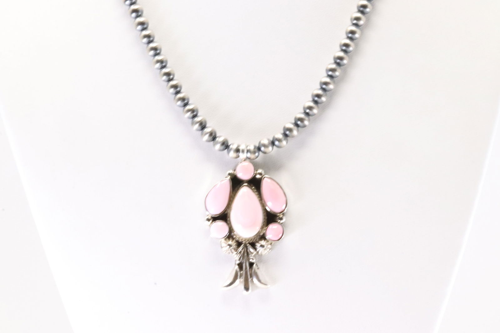 Native America Navajo Sterling Silver Punk Conch Shell Pendant By Bobby Platero. With Machine Made: This is a Native America Navajo Sterling Silver Pink Conch Shell Pendant By Bobby Platero. With Machine Made Setrling Silver Pearl Beaded Necklace. Necklace length: 16.00"