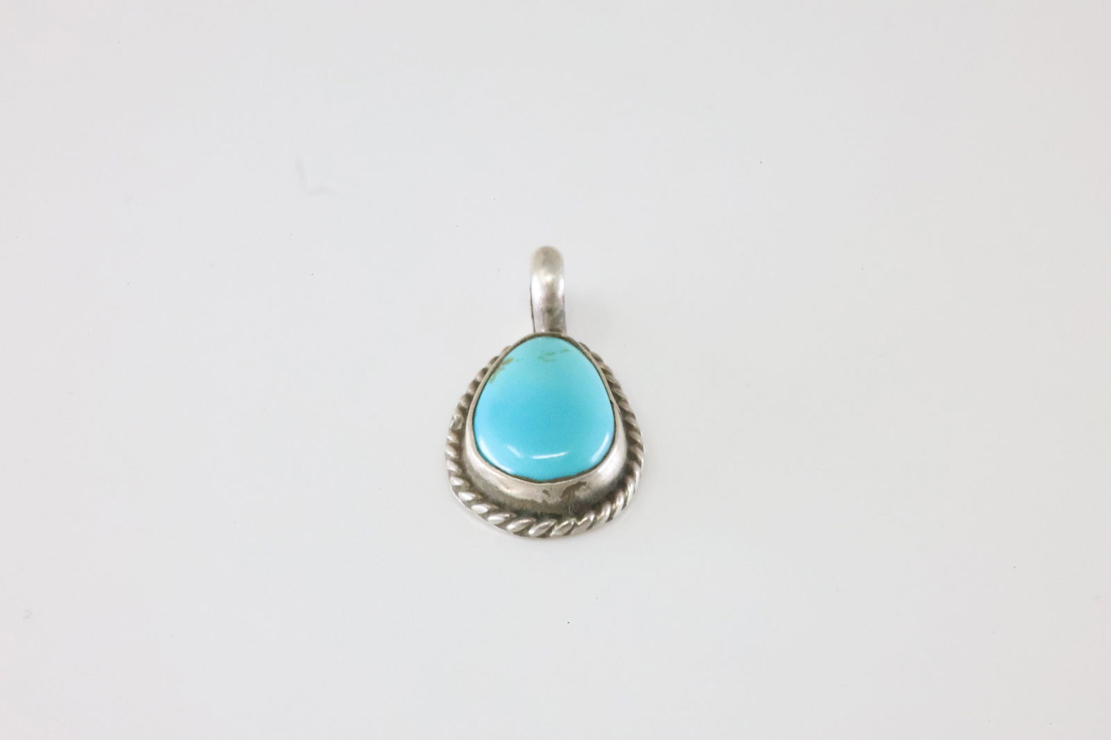 Native America Navajo Sterling Silver Turquoise Pendant By G James.: This is a Native America Navajo Sterling Silver Turquoise Pendant By G James. Stamp G James.