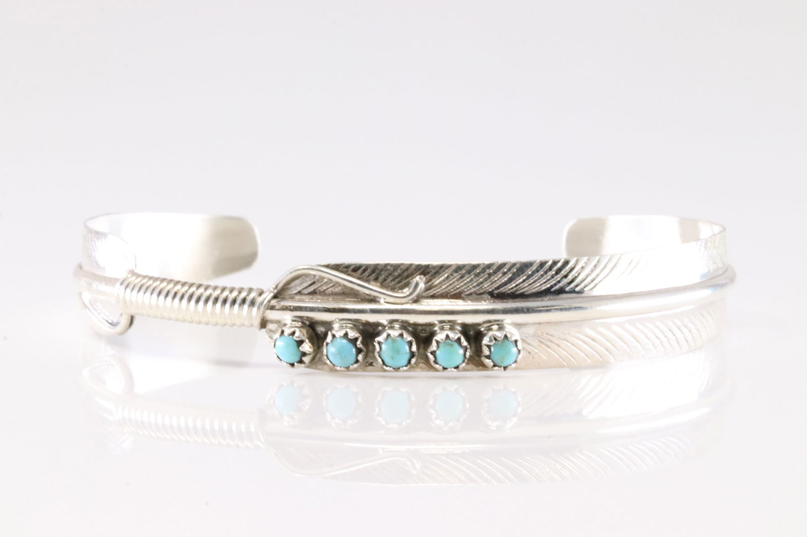 Native America Navajo Sterling Silver Turquoise Feather Bracelet Cuff By Aaron Davis. Stamp AD.: This is a Native America Navajo Sterling Silver Turquoise Feather Bracelet Cuff By Aaron Davis.