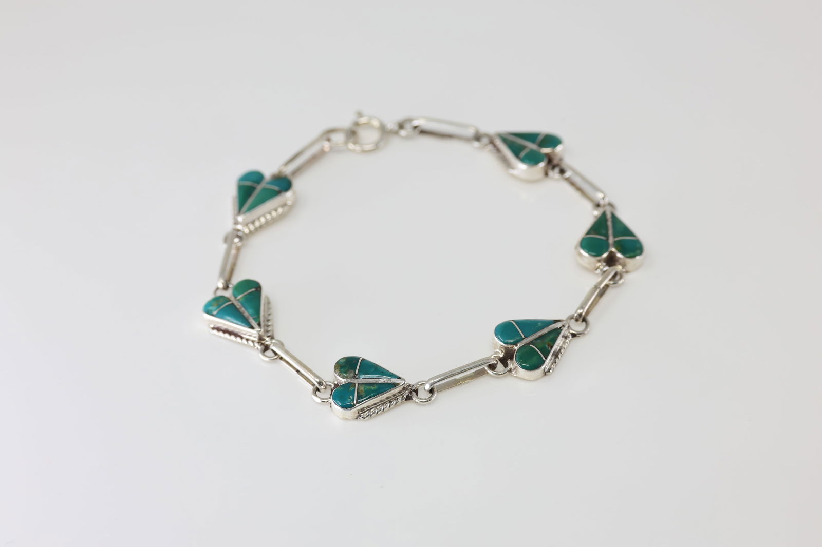 Native America Zuni Sterling Silver Turquoise Inlay Bracelet Link By RVN.: This is a Native America Zuni Sterling Silver Turquoise Inlay Bracelet Link By RVN. Stamp RVN. Bracelet Length: 15.00.