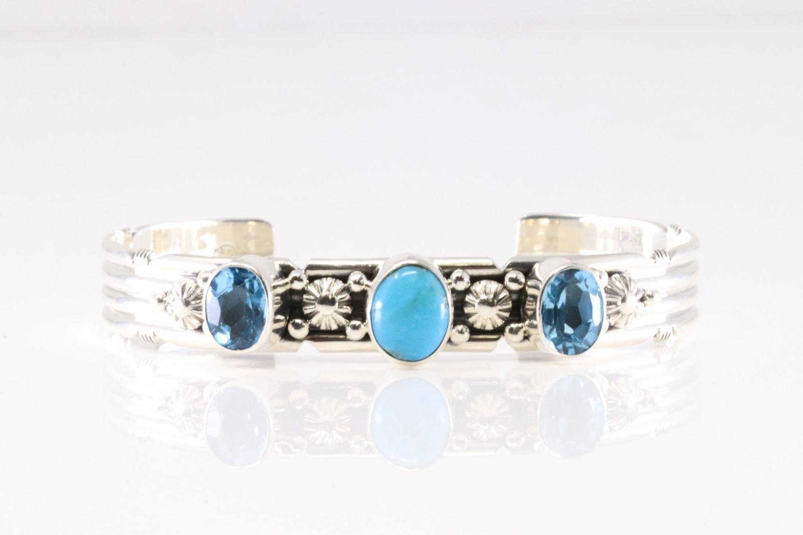 Native America Navajo Sterling Silver Blue Topaz & Turquoise Bracelet Cuff By Gilbert Smith. From: This is a Native America Navajo Sterling Silver Blue Topaz & Turquoise Bracelet Cuff By Gilbert Smith. From R.B Company. Stamp By R.B Company.