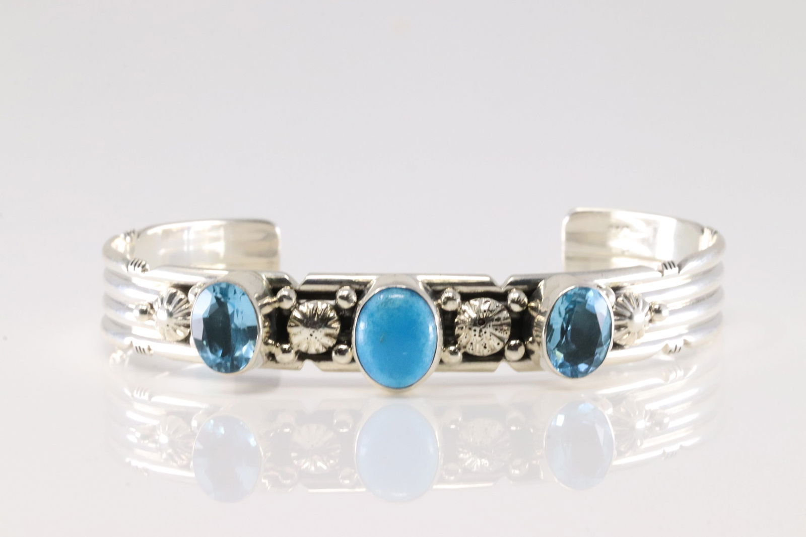 Native America Navajo Sterling Silver Blue Topaz & Turquoise Bracelet Cuff By Gilbert Smith. From: This is a Native America Navajo Sterling Silver Blue Topaz & Turquoise Bracelet Cuff By Gilbert Smith. From R.B Company. Stamp By R.B Company.