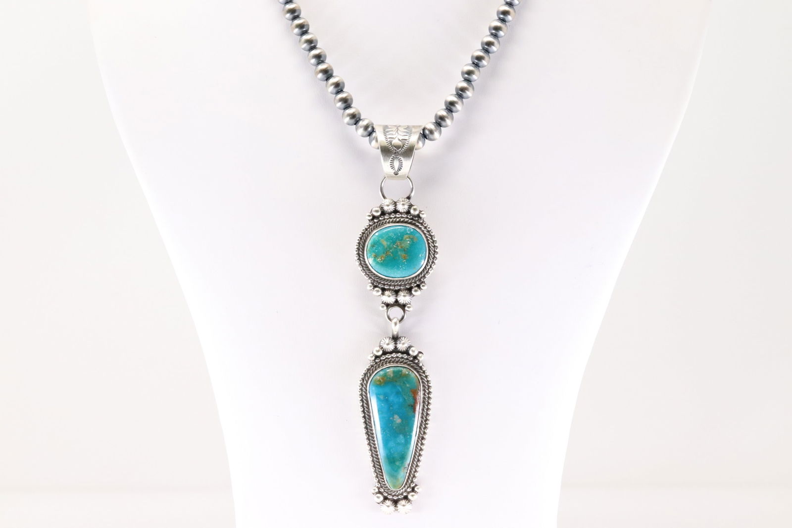 Native America Navajo Sterling Silver Turquoise Pendent By Tom Lewis With None Navajo Stearling: This is a Native America Navajo Sterling Silver Turquoise Pendent By Tom Lewis With None Navajo Stearling Silver Pearl Beaded Machine Made Necklace. Stamp Tom Lewis. Necklace length: 18.00" Total weig