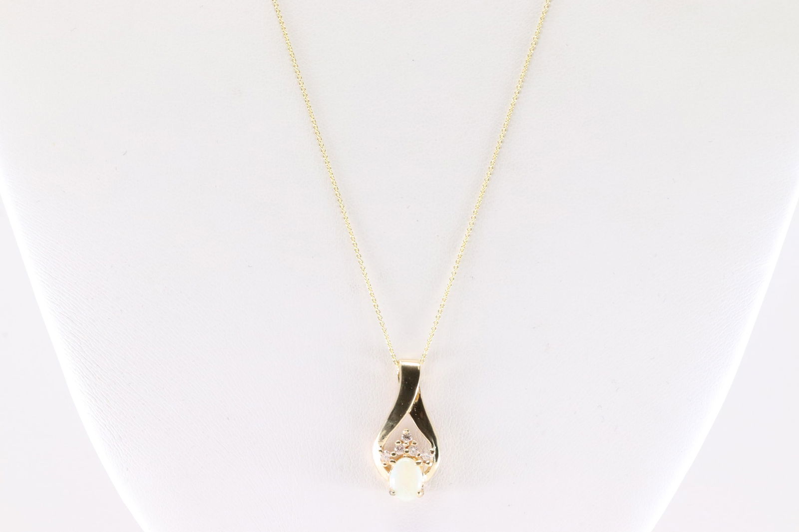 Opal & Diamond Pendant / Necklace 14Kt.: Ladies 14Kt Yellow Gold Opal & Diamond Pendant / Necklace. This Necklace has Opal Pendant With 5 Round Sparkling Diamonds. Necklace Length: 20.00. Total Weight: 3.20 Grams.