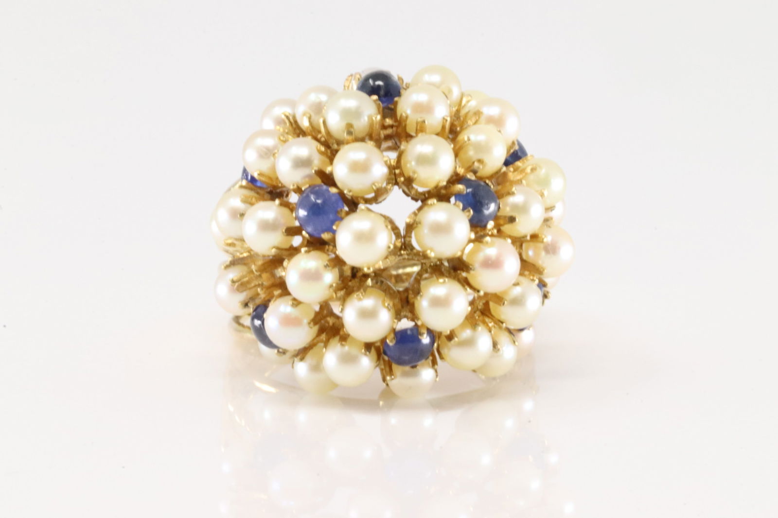 Pearl & Sapphire Cocktail Ring 14Kt.: Ladies 14Kt yellow Gold Pearl & Sapphire Cocktail Ring. This elegant ring has cocktail of pearls and sapphire's. Ring size: 6.25. Total weight: 8.60 Grams.