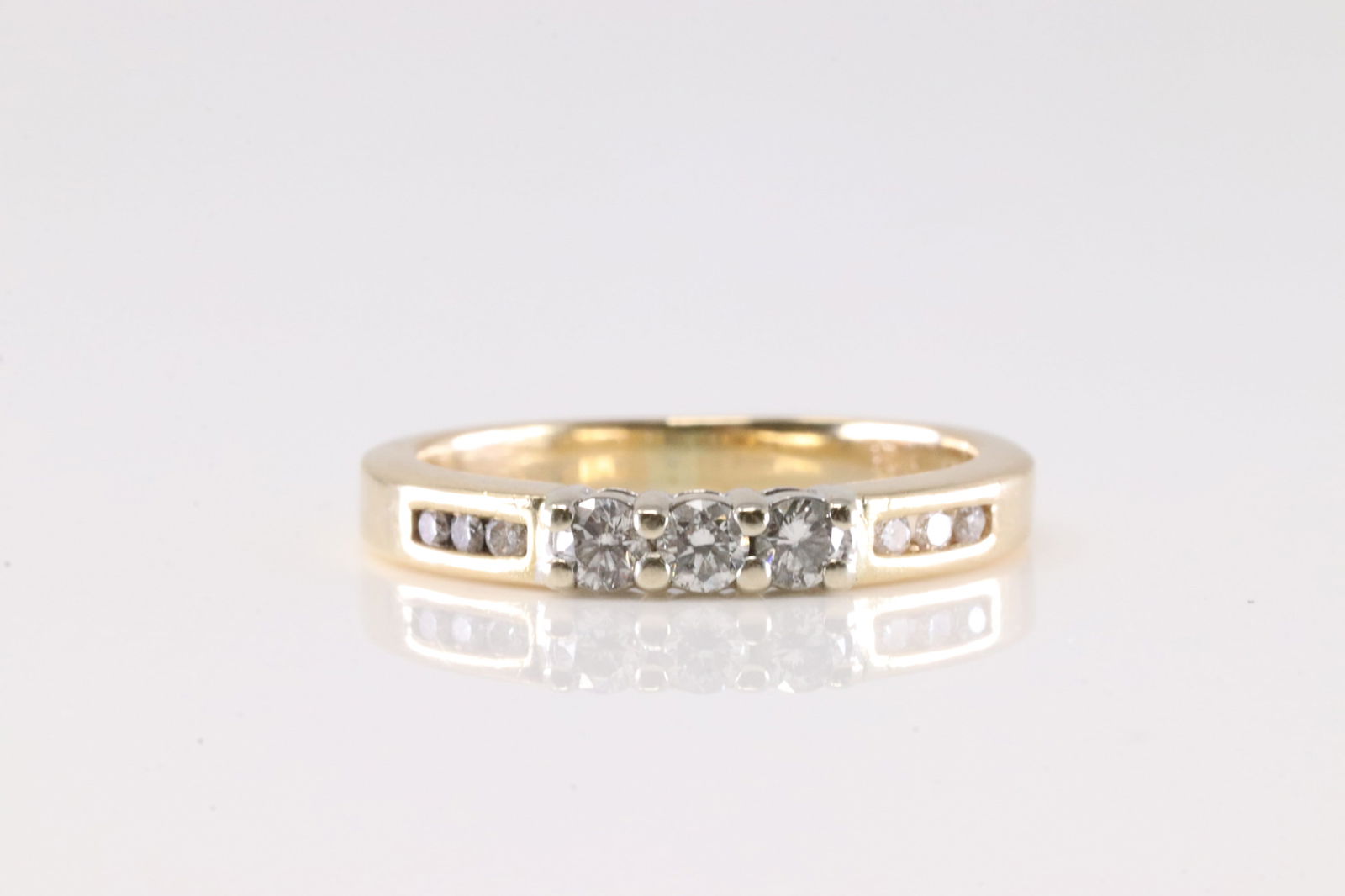 Diamond Ring 14Kt.: Ladies 14Kt Yellow Gold Diamond Ring. This Charming Ring has 9 Round Sparkling Diamonds. Diamond Weight Approx: 0.20 ctw Ring Size: 5.00. Total Weight: 2.80 Grams.