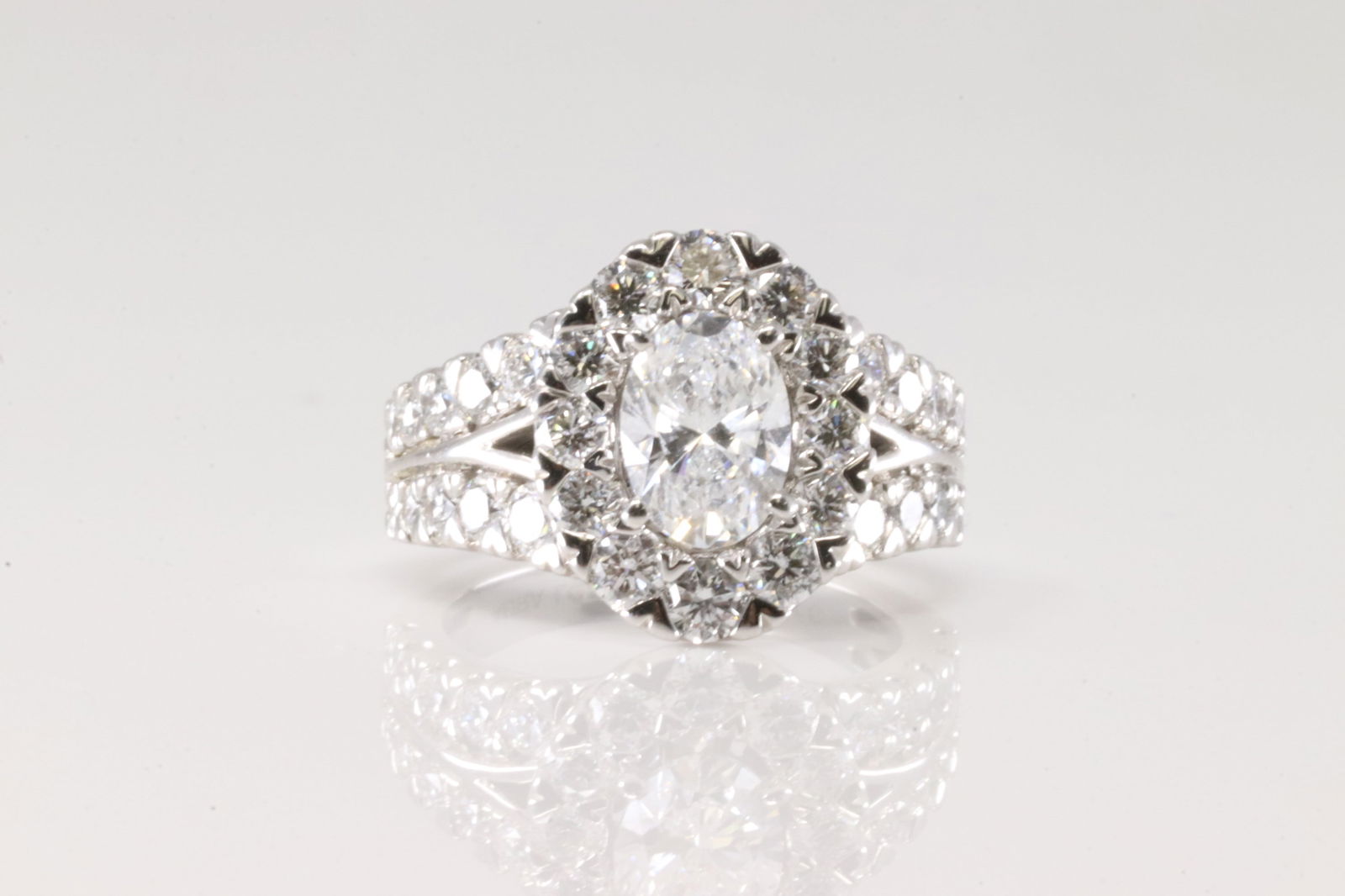 Elegant Diamond Wedding Ring 14Kt.: Ladies 14Kt White Gold Lab Grown Diamond Wedding Ring. This elegant and charming ring has oval sparkling diamond on the center, surrender by 32 round Lab Grown diamonds. Lab Grown Diamonds weight appr