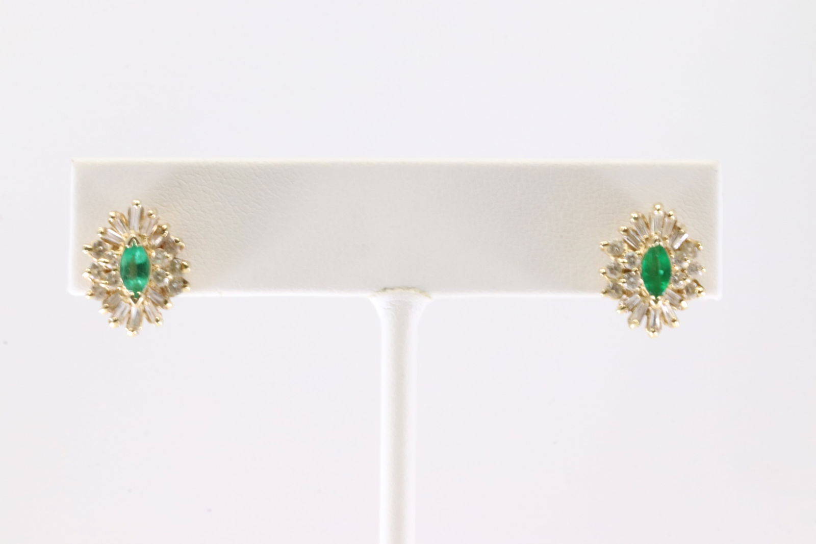 Emerald & Diamond Stud Earring 14Kt.: Ladies 14Kt Yellow Gold Emerald & Diamond Stud Earring. This Earring's has Gorgeous Oval Emeral Gemstones With 20 Baguette / 20 Round Sparkling Diamonds. Diamond Approx Weight: 0.55 ctw Total Weight: