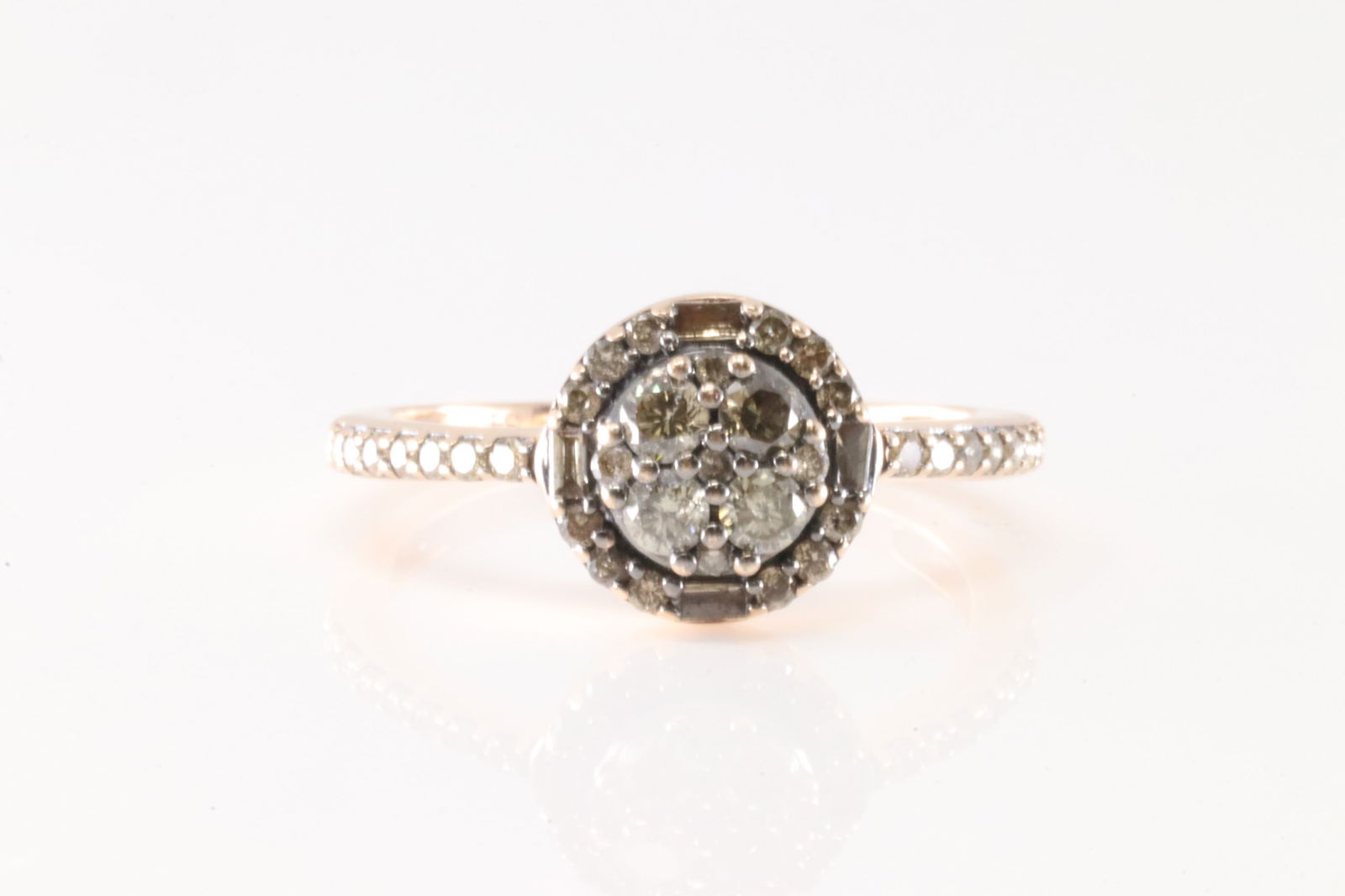 Elegant Diamond Ring 10Kt.: Ladies 10Kt Rose Gold Diamond Ring. This beautiful ring has 38 round & baguette diamonds. Diamonds weight approx: 0.85ctw. Ring size: 6.25. Total weight: 2.10 Grams.