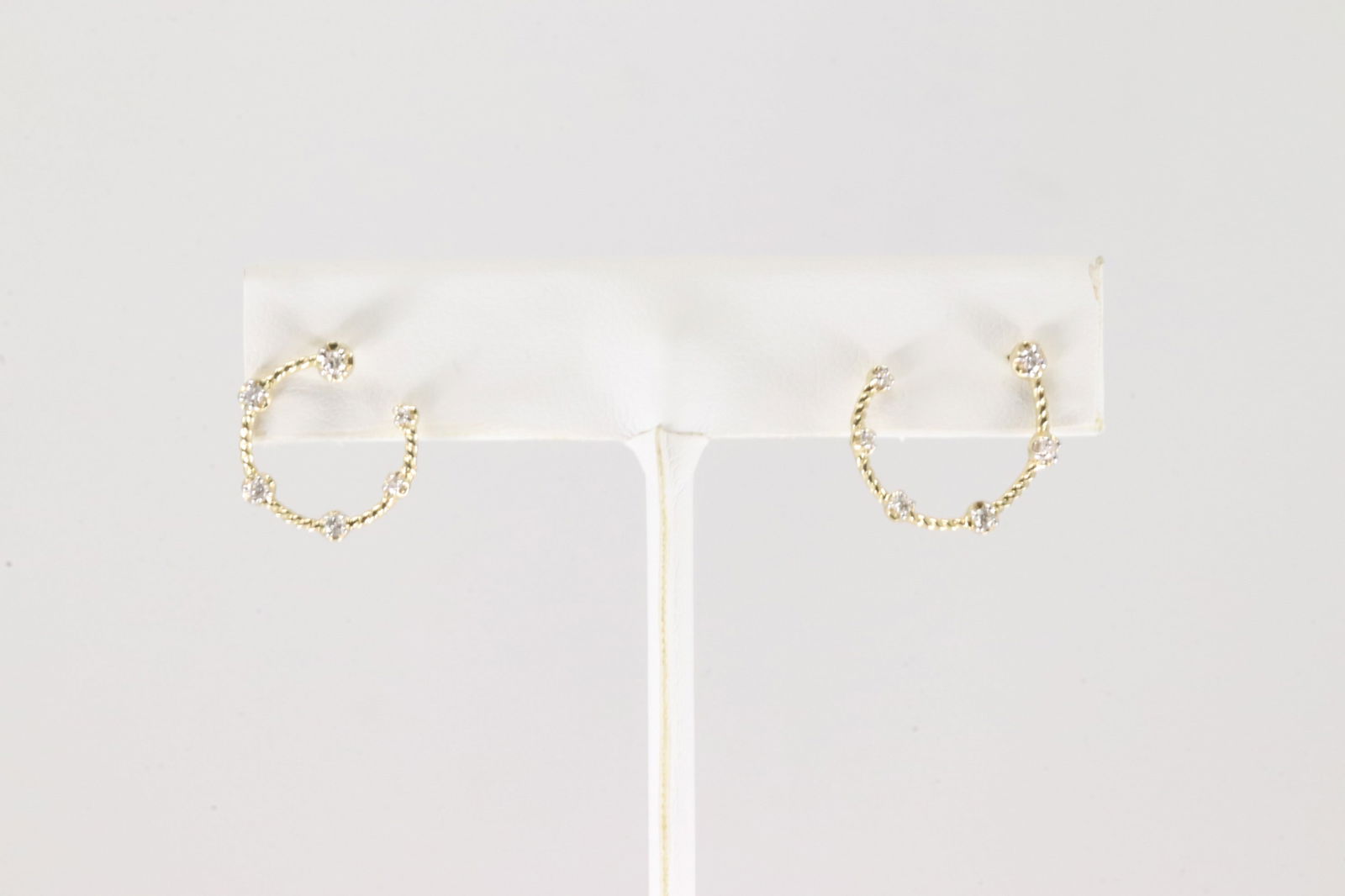 Diamond Hoop Earring 14Kt.: Ladies 14Kt Yellow Gold Diamond Hoop Earring. This Charming Earring's has 12 Sparkling Diamonds. Diamonds weight: 0.18ctw.