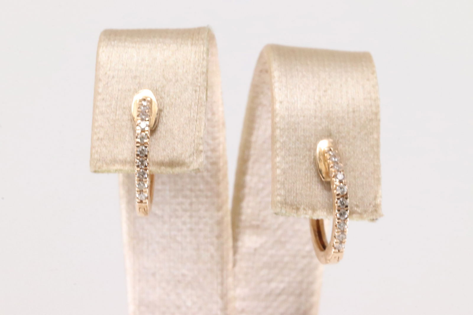Diamond Hoop Earring 14kt.: Ladies 14kt Rose Gold Diamond Hoop Earring. Elegant Rose Gold Earring's With 20 Round Sparkling Diamonds. Diamonds Weight: 0.11ct.