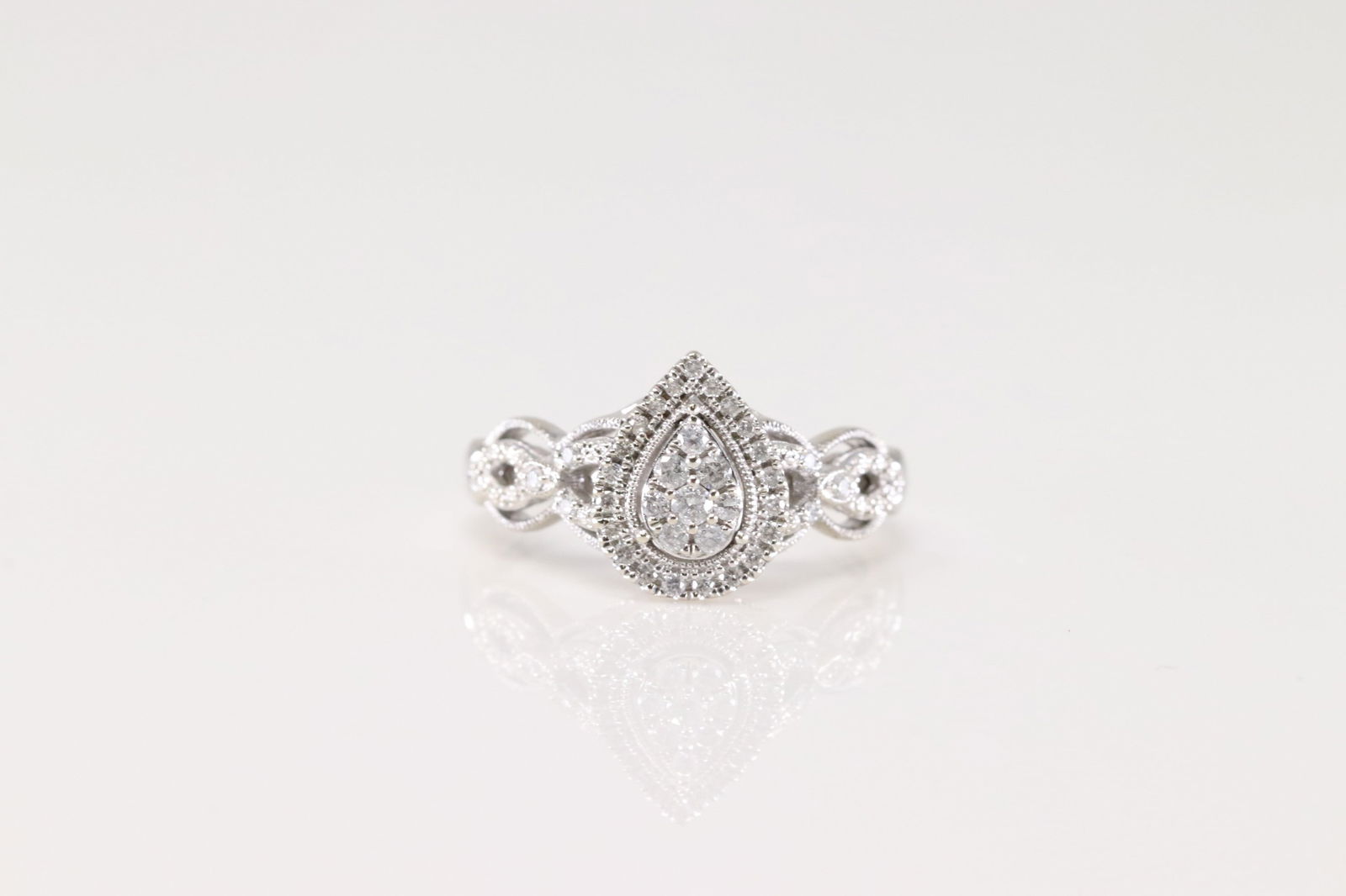 Engagement Diamond Ring 10Kt.: Ladies 10Kt White Gold Engagement Diamond Ring. This Elegant Ring has Pear-Shape Design with Sparkling Diamonds. Diamonds weight approx: 1.00 ctw Ring size: 7.00. Total weight: 3.60 Grams.