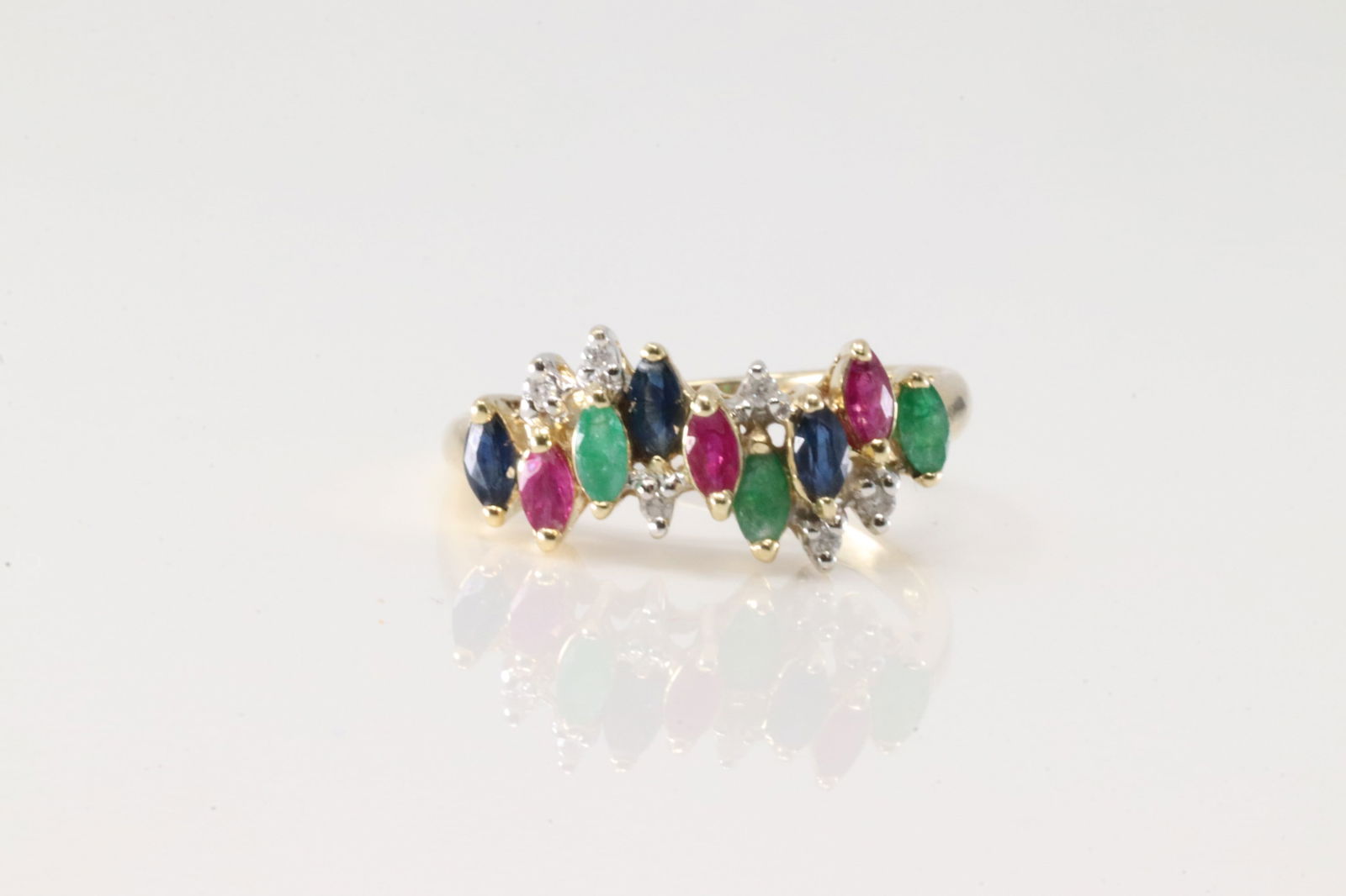 Multi-Color Gems & Diamond Ring 14Kt.: Ladies 14Kt Yellow Gold Multi-Color gems & Diamond Ring. This charming ring has marquise rubies-sapphire- emerald & diamonds. Ring size: 7.00. Total weight: 3.00 Grams.