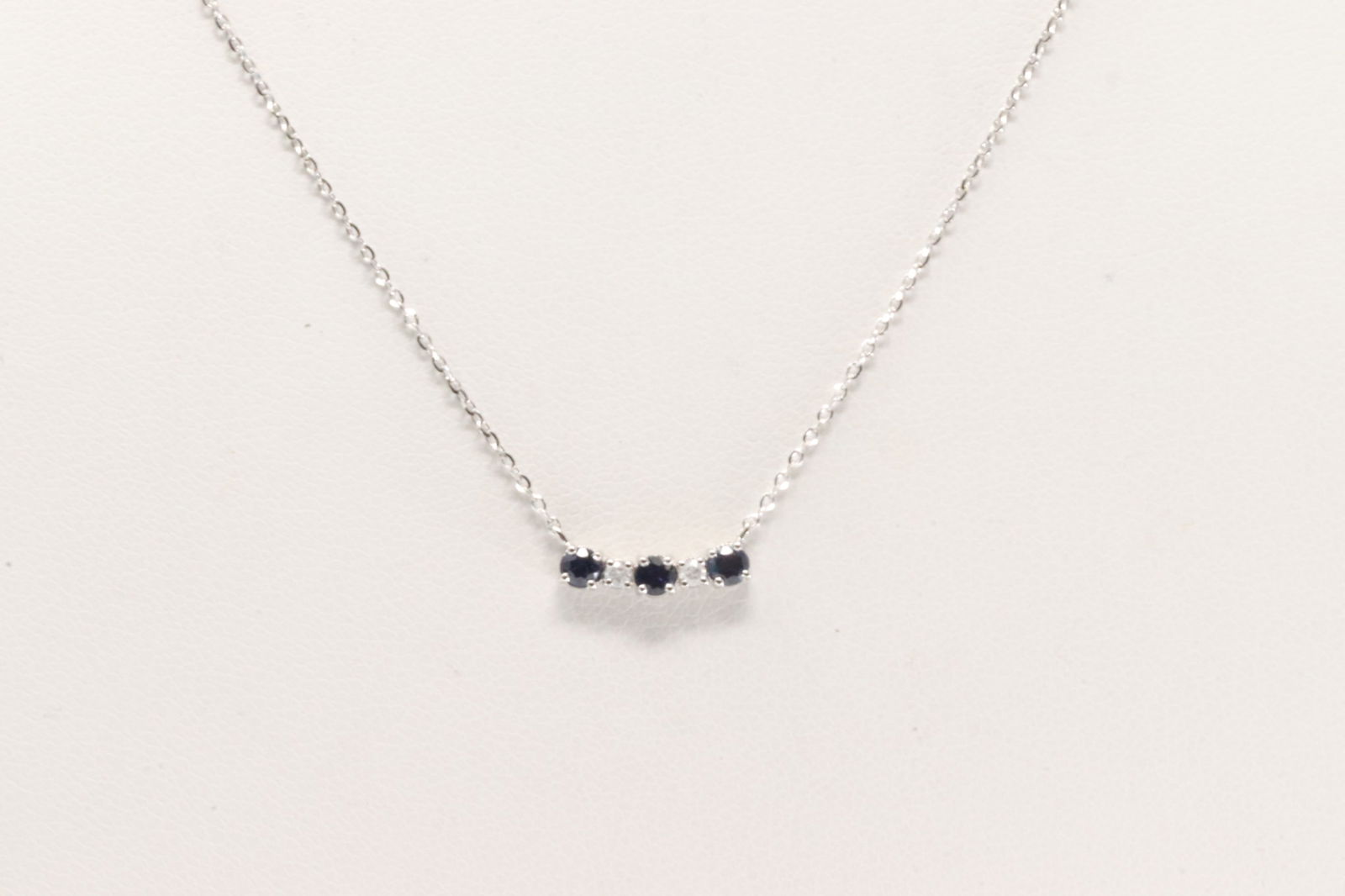 Sapphire & Diamond Necklace 14Kt.: Ladies 14Kt White Gold Sapphire & Diamond Necklace. This Chaming Necklace has a Charm with Blue Sapphire Y Sparkling Diamonds. Diamonds weight: 0.04ctw. Sapphires weight: 0.25ctw.