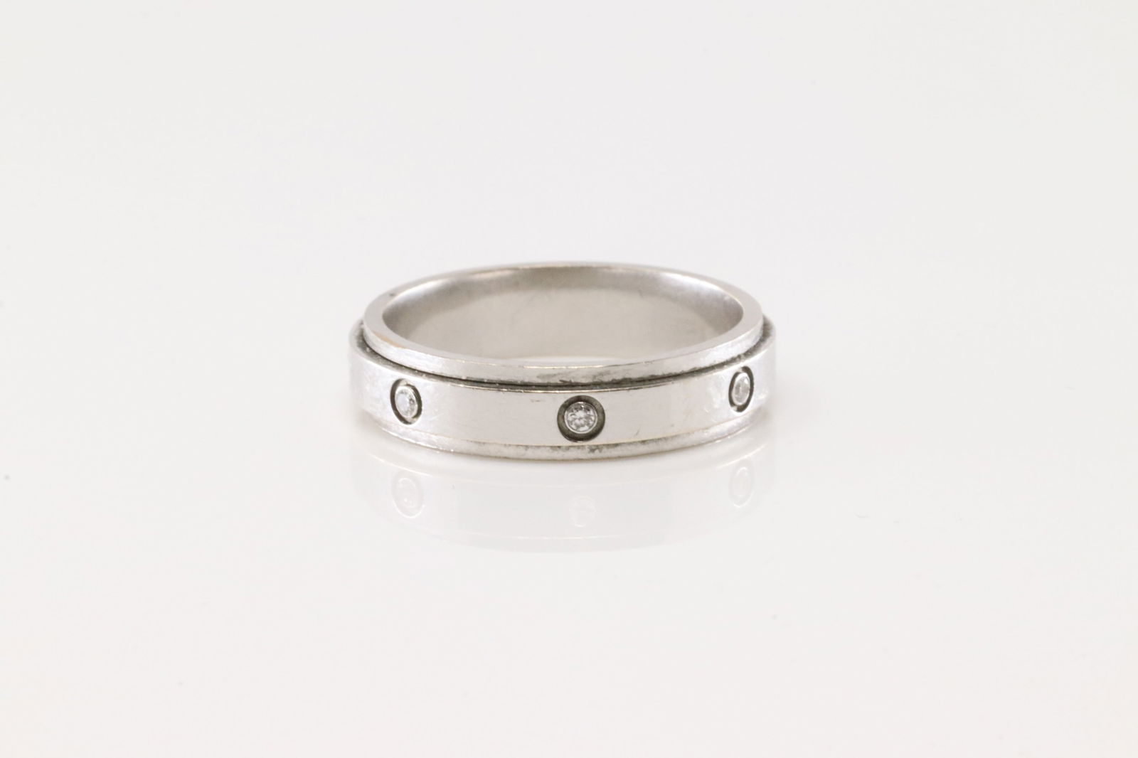 Piaget Eternity Diamond Ring 18Kt.: 18Kt White Gold Eternity Diamond Ring. This elegant eternity diamond band ring has 7 round diamond. Ring size: 7.25. Total weight: 5.90 Grams.