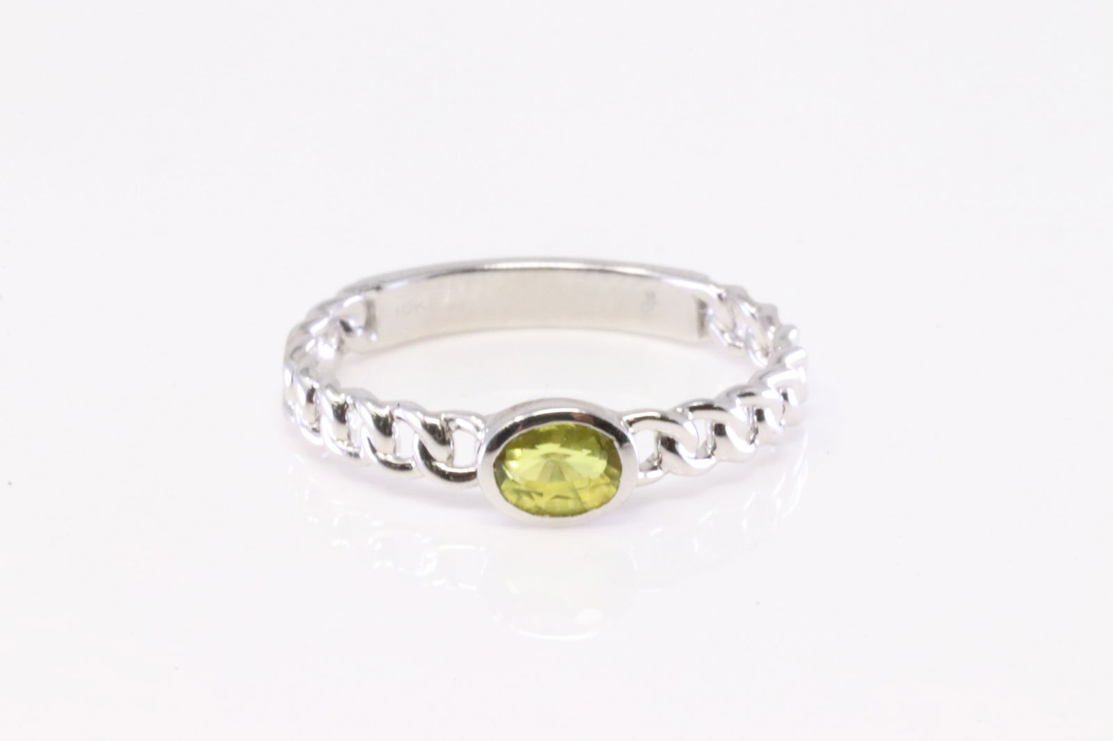 Yellow Stone Ring 10Kt.: Ladies 10Kt White Gold Yellow Stone Ring. Ring has Oval Yellow Stone. Ring size: 7.00. Total weight: 2.00 Grams.