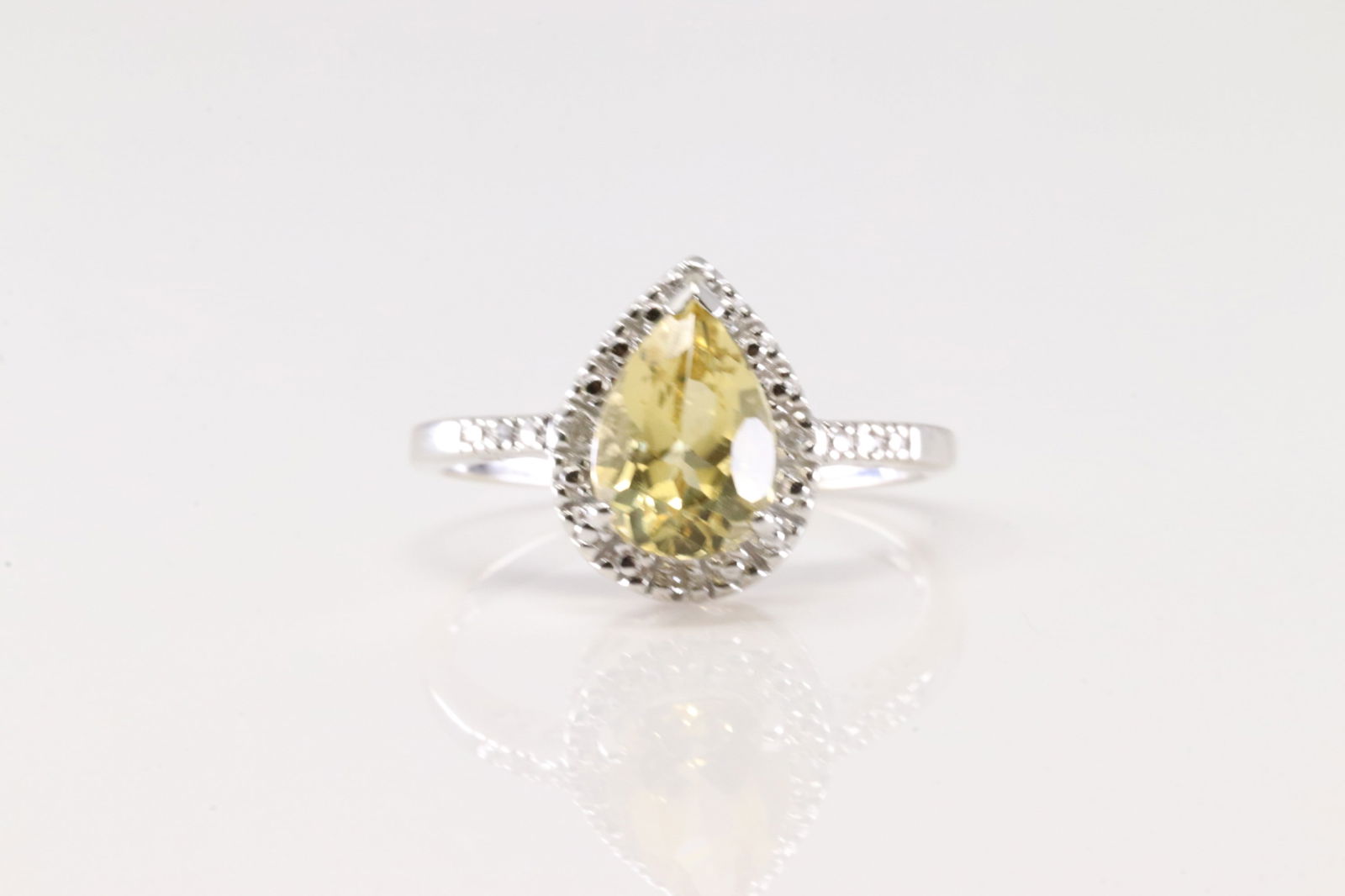 Citrine & Diamond Ring 14Kt.: Ladies 14Kt White Gold Citrine & Diamond Ring. This Elegant Ring has Pear Shaped Citrine Gemstone & 6 Round Sparkling Diamonds. Diamond Weight Approx: 0.50ctw. Ring Size: 9.00.