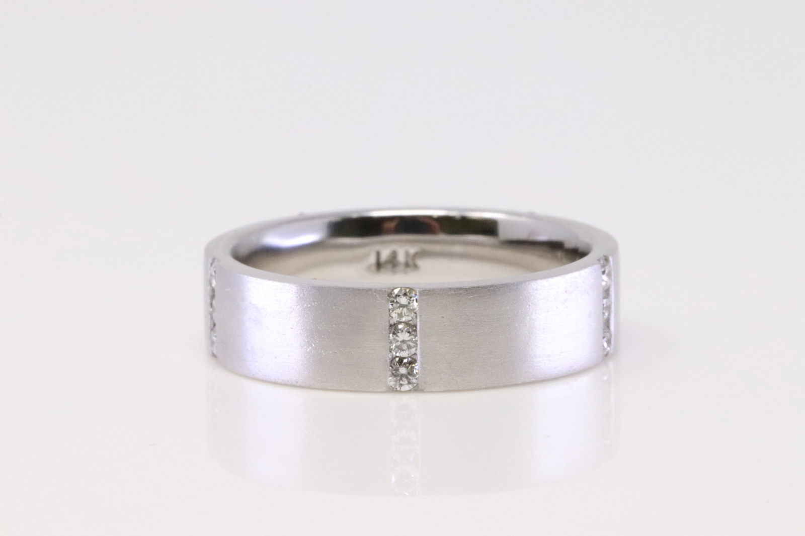 14Kt White Gold Eternity Diamond Ring.: 14Kt White Gold Eternity Diamond Ring. Ring has 15 round Diamonds. Diamonds weight: 0.42ctw. Ring size: 5.75. Total weight: 5.54 Grams.