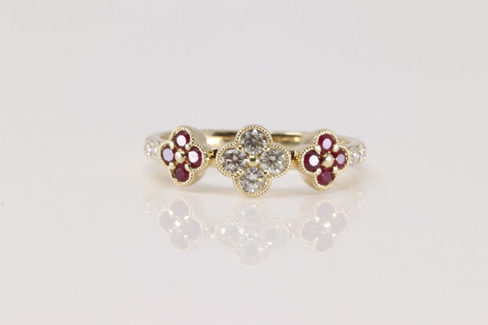 Ruby & Diamond Ring 14Kt.: Ladies 14Kt Yellow Gold Ruby & Diamond Ring. This Charming Ring has 3 Fflower Design with Pink Rubies and Sparkling Diamonds. Diamonds weight: 0.26ctw. Rubies weight: 0.26ctw. Ring size: 6.50.