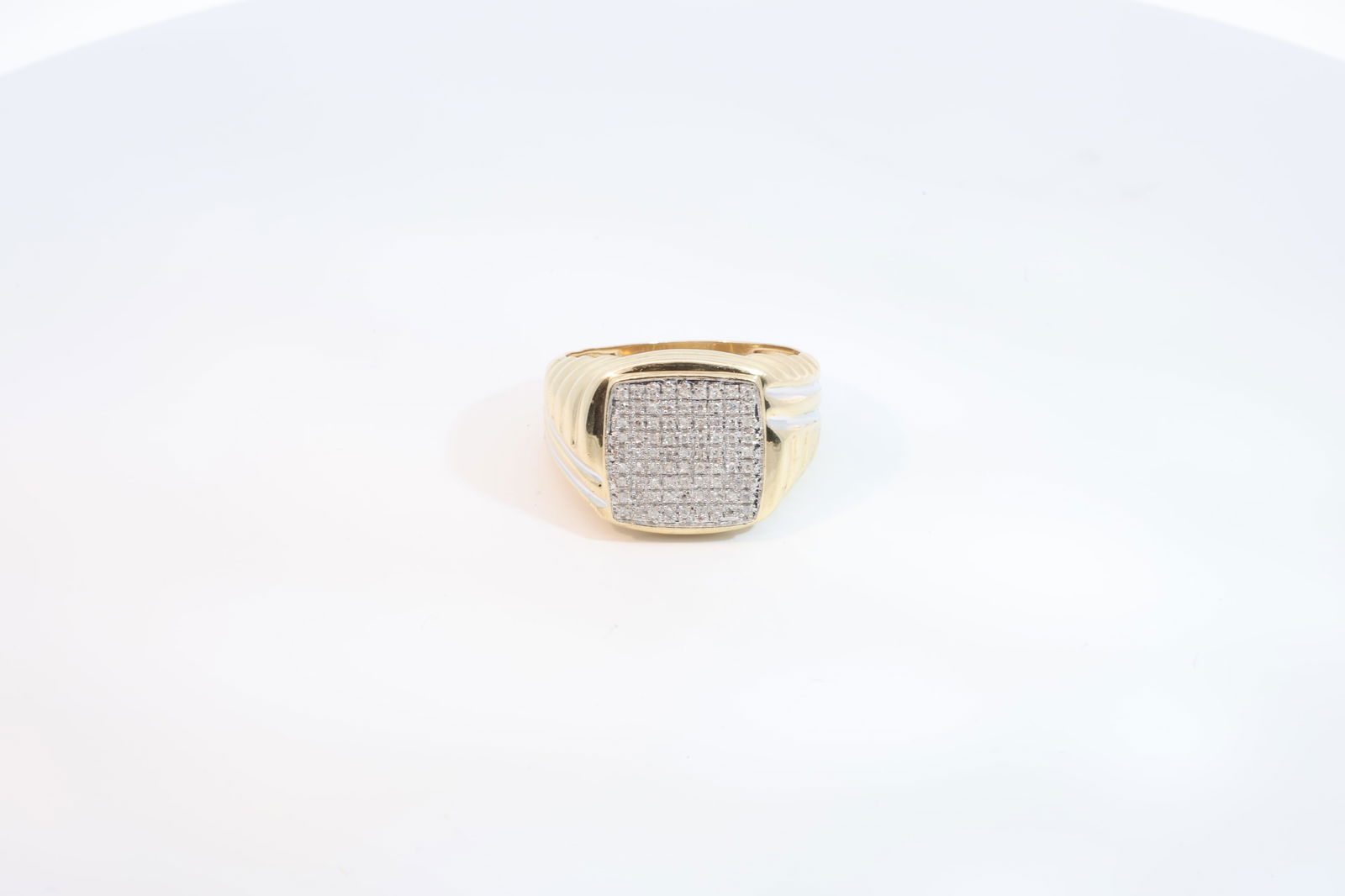 10Kt Yellow Gold Diamond Ring.: Mens 10Kt Yellow Gold Ring. This Beautiful Mens Square Ring Comes With Stripe Designs On the Edges And 81 Round Cut Diamonds In The Center. Ring size: 9.5 Total Weight: 6.10 Grams.