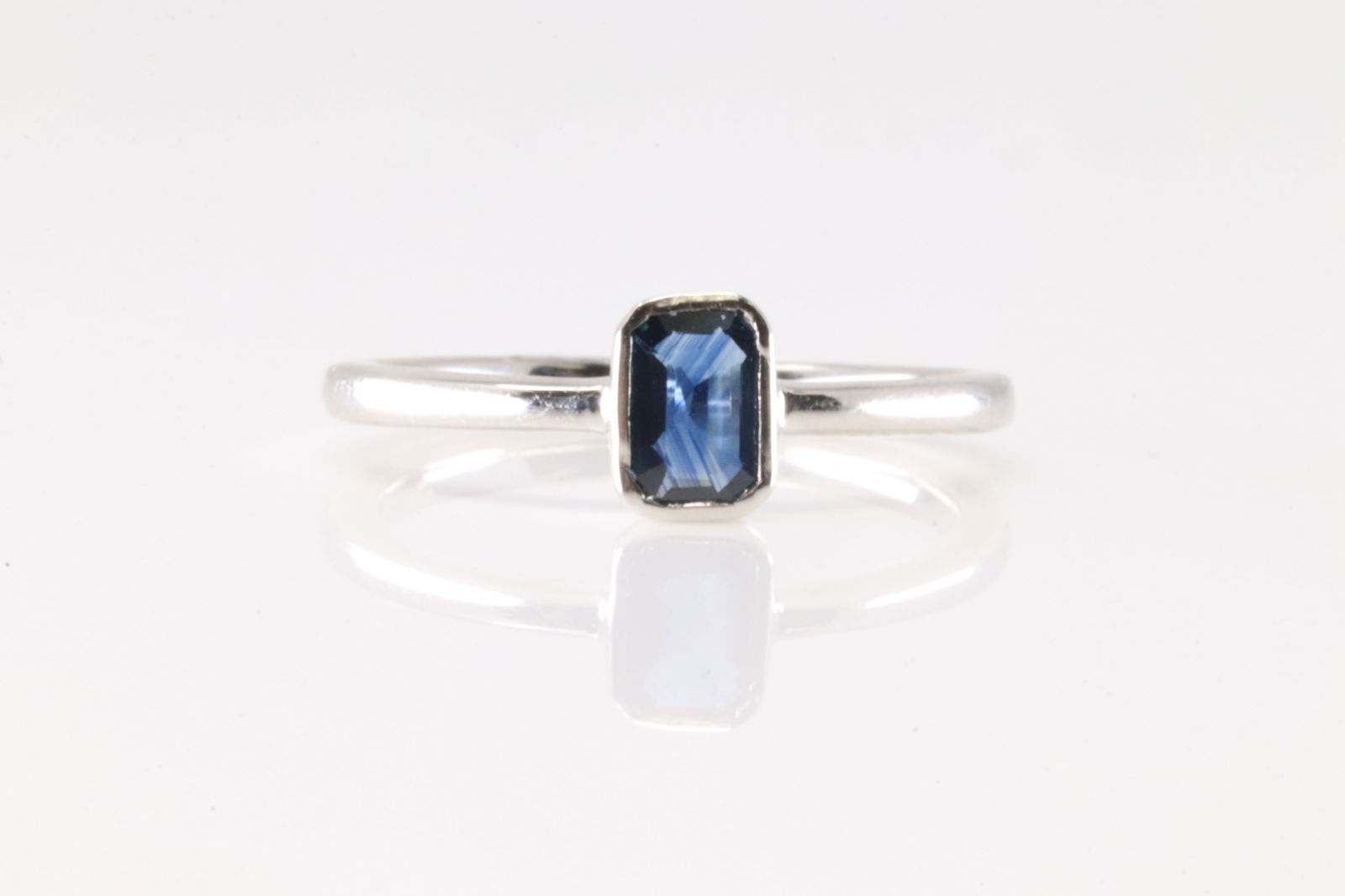 Sapphire Ring 14Kt.: Ladies 14Kt White Gold Sapphire Ring. This Charming has Slitaire Sapphire. Sapphire weight: 0.59ctw. Ring size: 6.00.