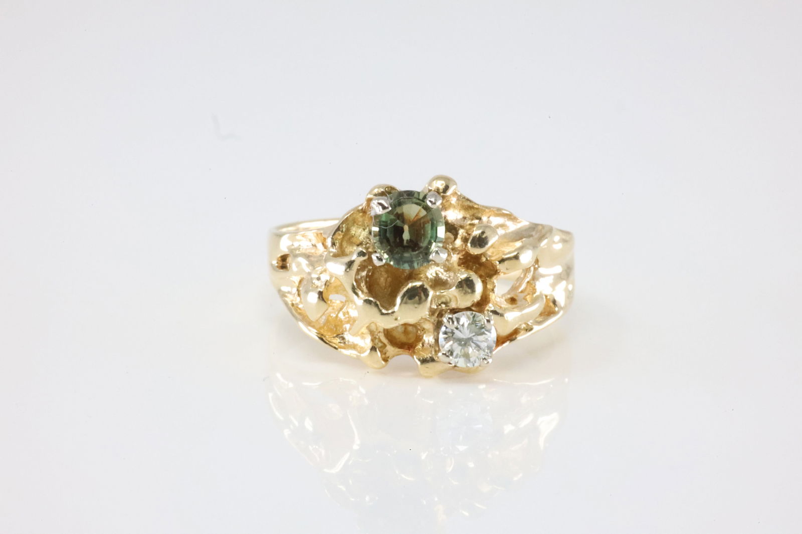 Nugget Diamond Ring: 14Kt Yellow Gold Green Color Stone & Diamond Ring. This Charming Ring has Green Stone with Sparkling Diamond. Ring size: 7.25. Total weight: 6.06 Grams.