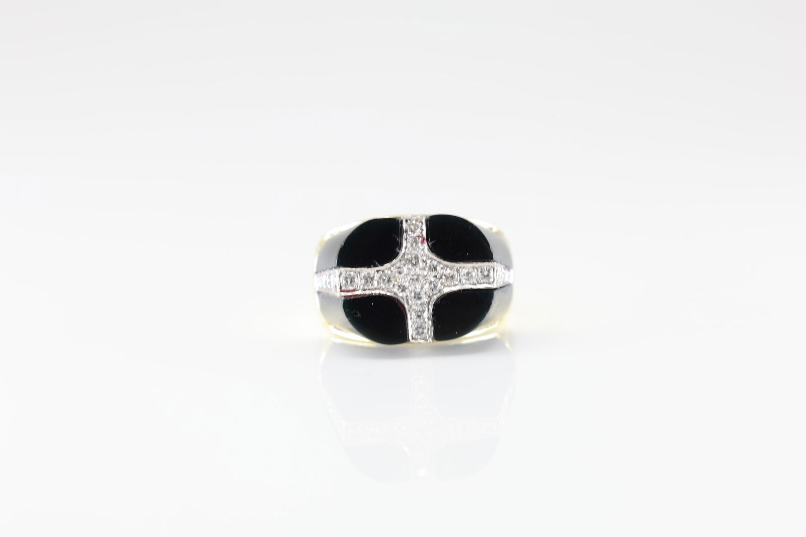 Black Onyx & Diamond Ring 14Kt.: 14Kt Yellow Gold Black Onyx & Diamond Ring. ring has a black onyx gems with unique design, elegantly intersected by a shimmering cross of 27 sparkling diamonds. this piece is ideal for those who appre