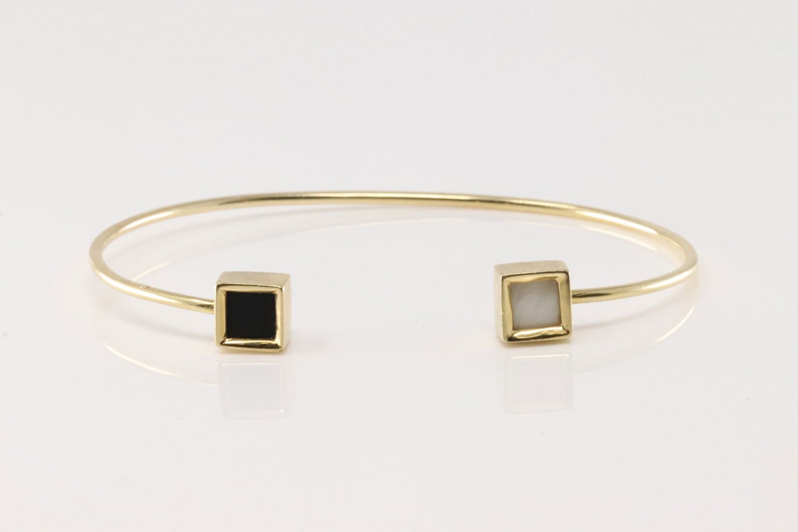 Pearl & Sapphire Bangle Bracelet 14Kt.: 14Kt Yellow Gold Pearl & Sapphire Bangle Bracelet. This bangle bracelet has cut pearl & Sapphire. Total weight: 7.60 Grams.