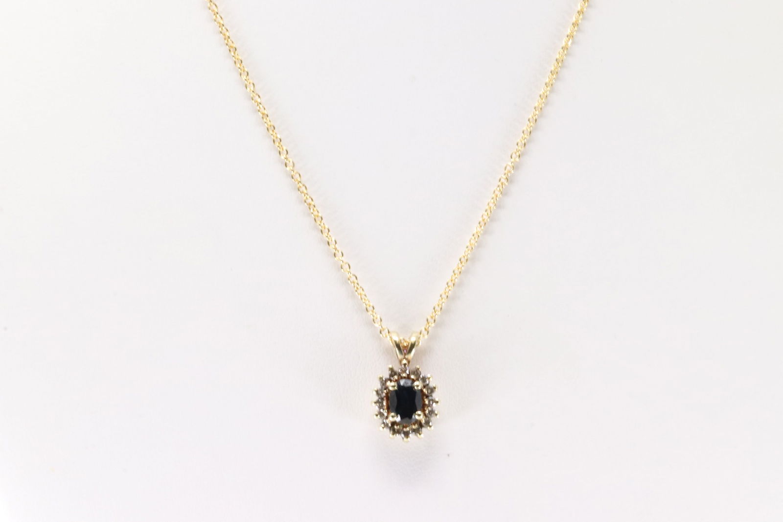 Sapphire & Diamond Pendant / Necklace 14Kt.: Ladies 14Kt Yellow Gold Sapphire & Diamond Pendant / Necklace. This Charming Pendant has Oval Sapphire with Sparkling Diamonds and A 14Kt. Necklace length: 16.00" Total weight: 4.10 Grams.