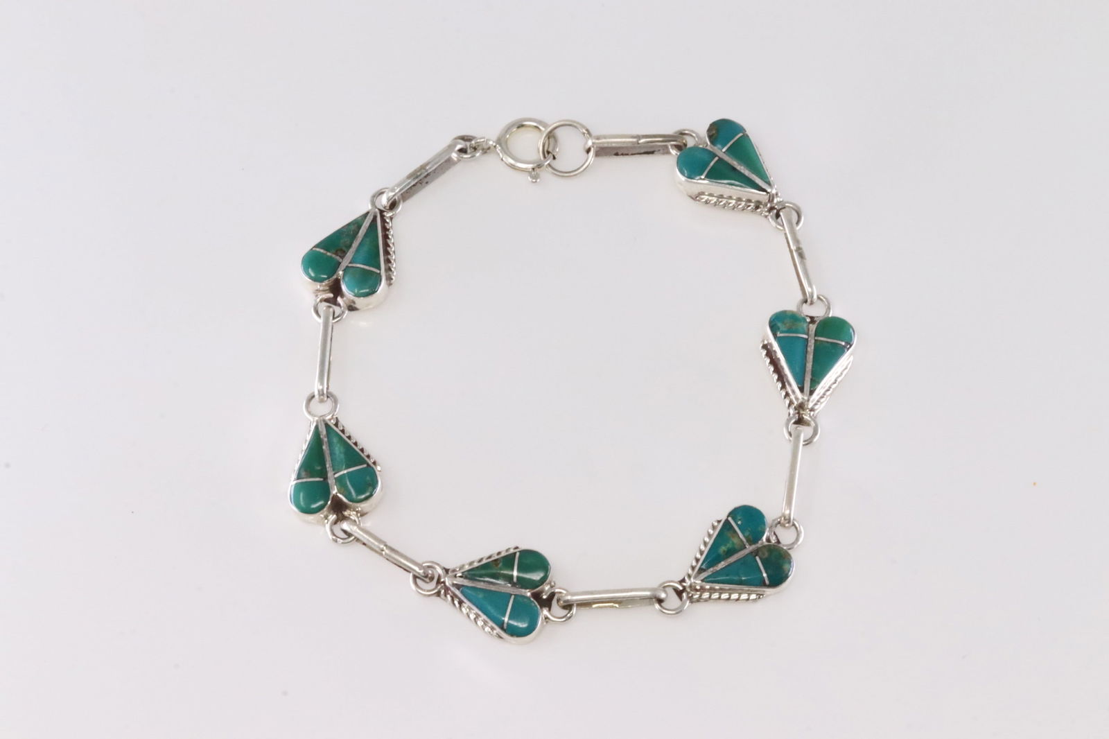 Native America Zuni Sterling Silver Turquoise Inlay Bracelet Link By RVN.: This is a Native America Zuni Sterling Silver Turquoise Inlay Bracelet Link By RVN. Stamp RVN. Bracelet Length: 15.00.