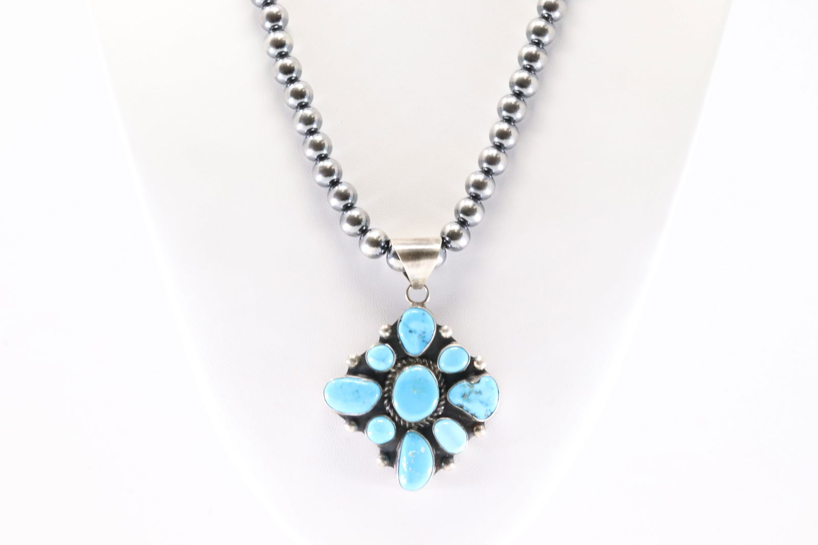 Native America Navajo Sterling Silver Kingman Turquoise Pendant By W.D. With Sterling Silver Peral: This is a Native America Navajo Sterling Silver Kingman Turquoise Pendant By W.D. With Sterling Silver Peral Beaded Machine Made Necklace. Necklace length: 18.00"