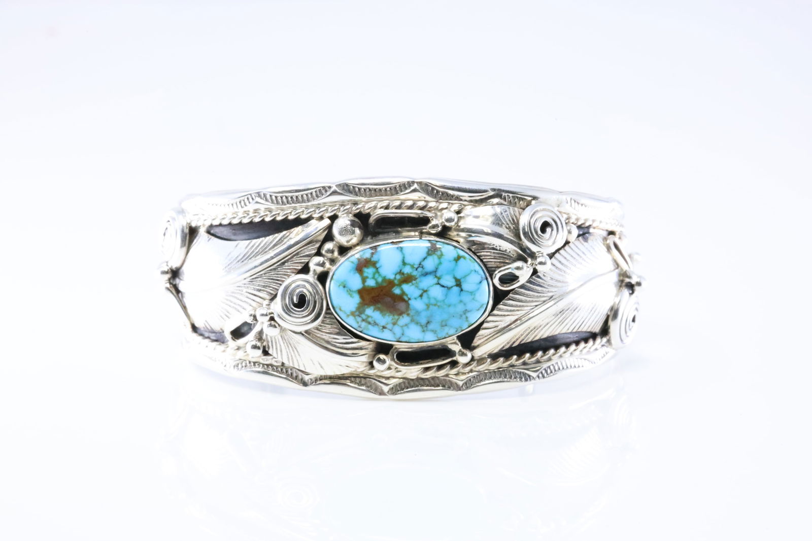 Native America Navajo Sterling Silver Turquoise Feather Bracelet Cuff By Darrell Morgan.: This is a Native America Navajo Sterling Silver Turquoise Feather Bracelet Cuff By Darrell Morgan. Stamp DM.