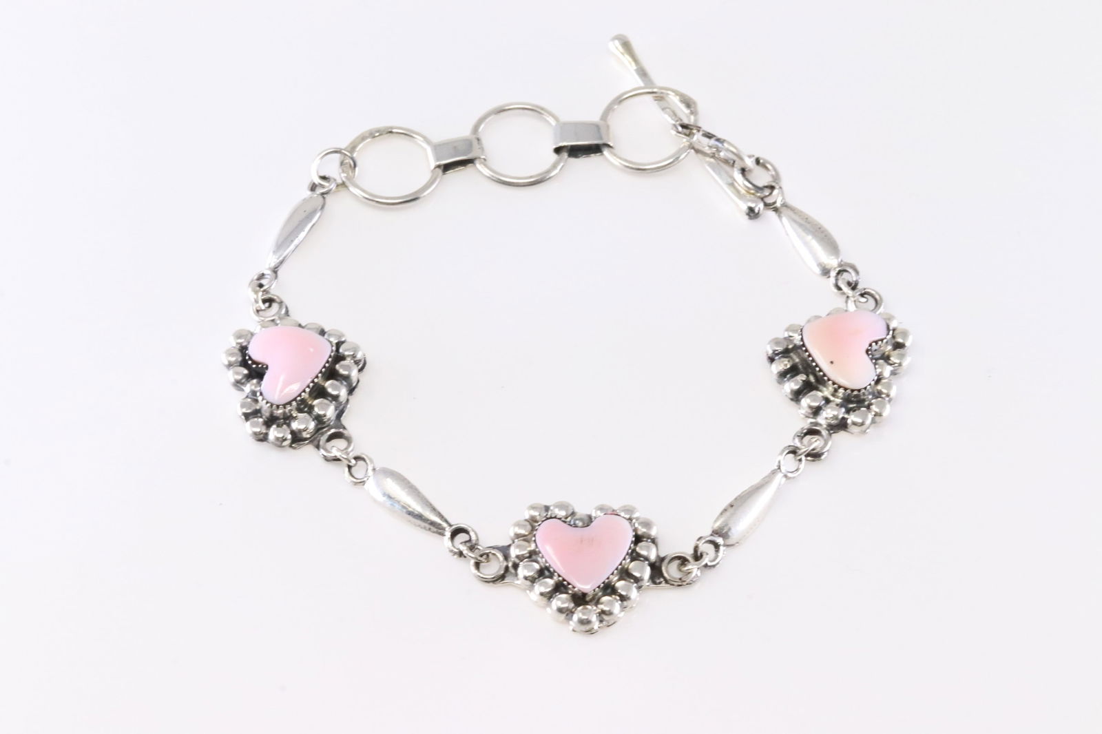 America Sterling Silver Pink Conch Shell Heart Bracelet Link.: This is a America Sterling Silver Pink Conch Shell Heart Bracelet Link. Bracelet length: 9.00" Adjustable.