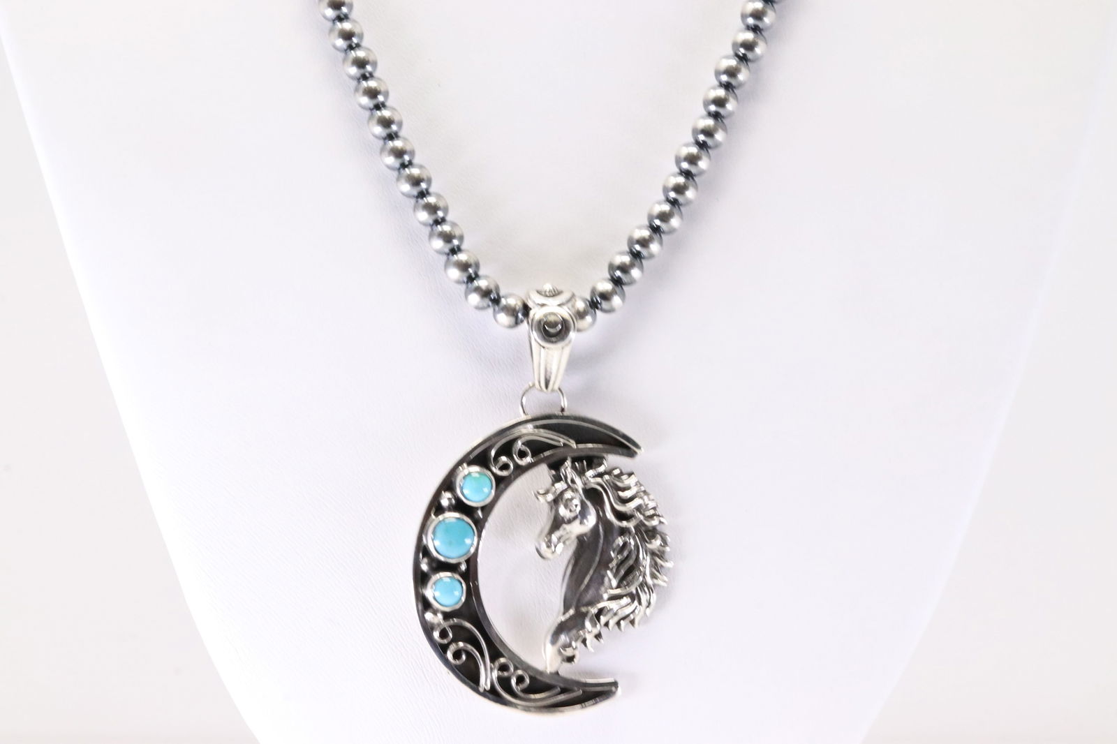 America Sterling Silver Turquoise Horse Pendant With Machine Made Staerling Silver Pearl Beaded: This is a America Sterling Silver Turquoise Horse Pendant With Machine Made Staerling Silver Pearl Beaded Necklace. Necklace Length: 18.00.