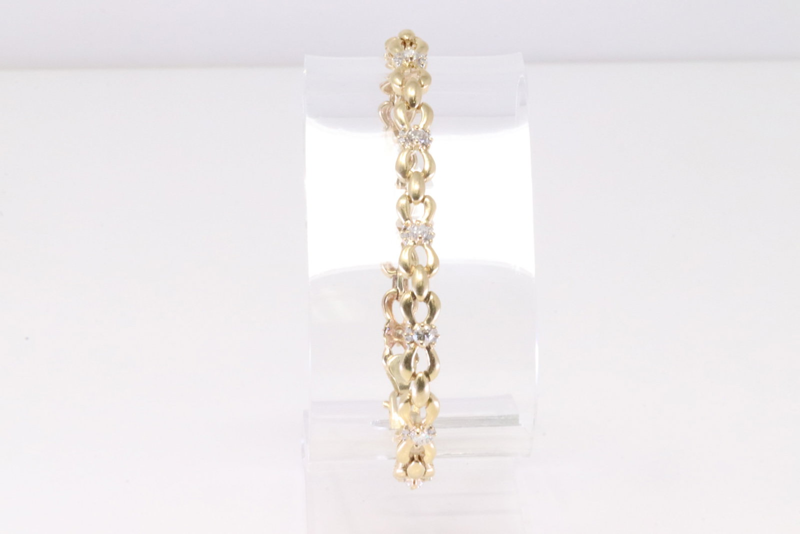 14Kt Yellow Gold Diamond Bracelet.: Ladies 14Kt Yellow Gold Diamond Bracelet. Bracelet has 50 Diamonds side to side. Bracelet length: 7.5" Total weight: 12.23 Grams.
