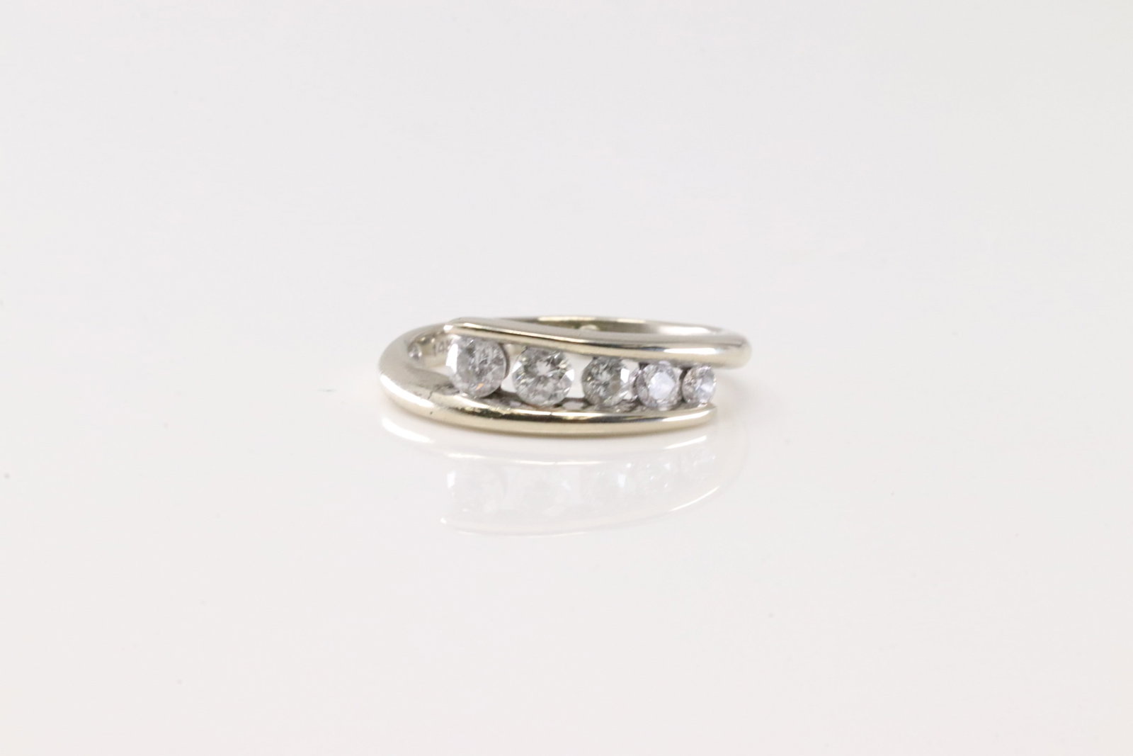 Diamond Ring 14Kt.: Ladies 14Kt White Gold Diamond Ring. This Elegant Ring has 5 Round Sparkling Diamonds. Diamond Weight Approx: 0.40CTW. Ring Size: 4.00. Total Weight: 2.57 Grams.